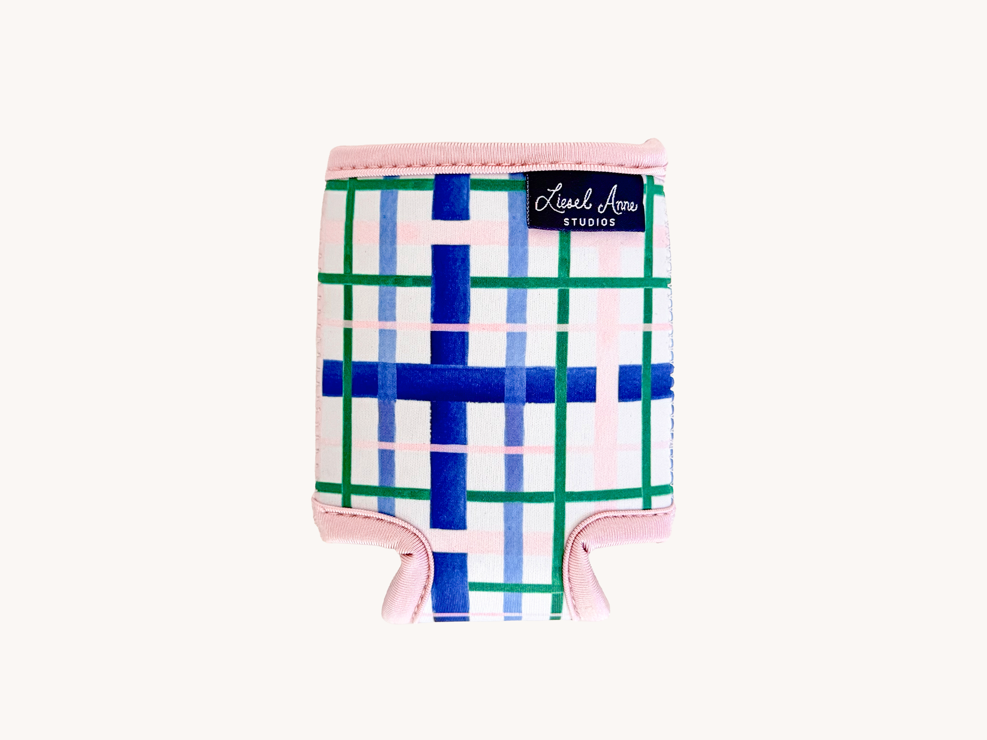A pink and white plaid cooler with a label that says "Liesl Arie Studio".