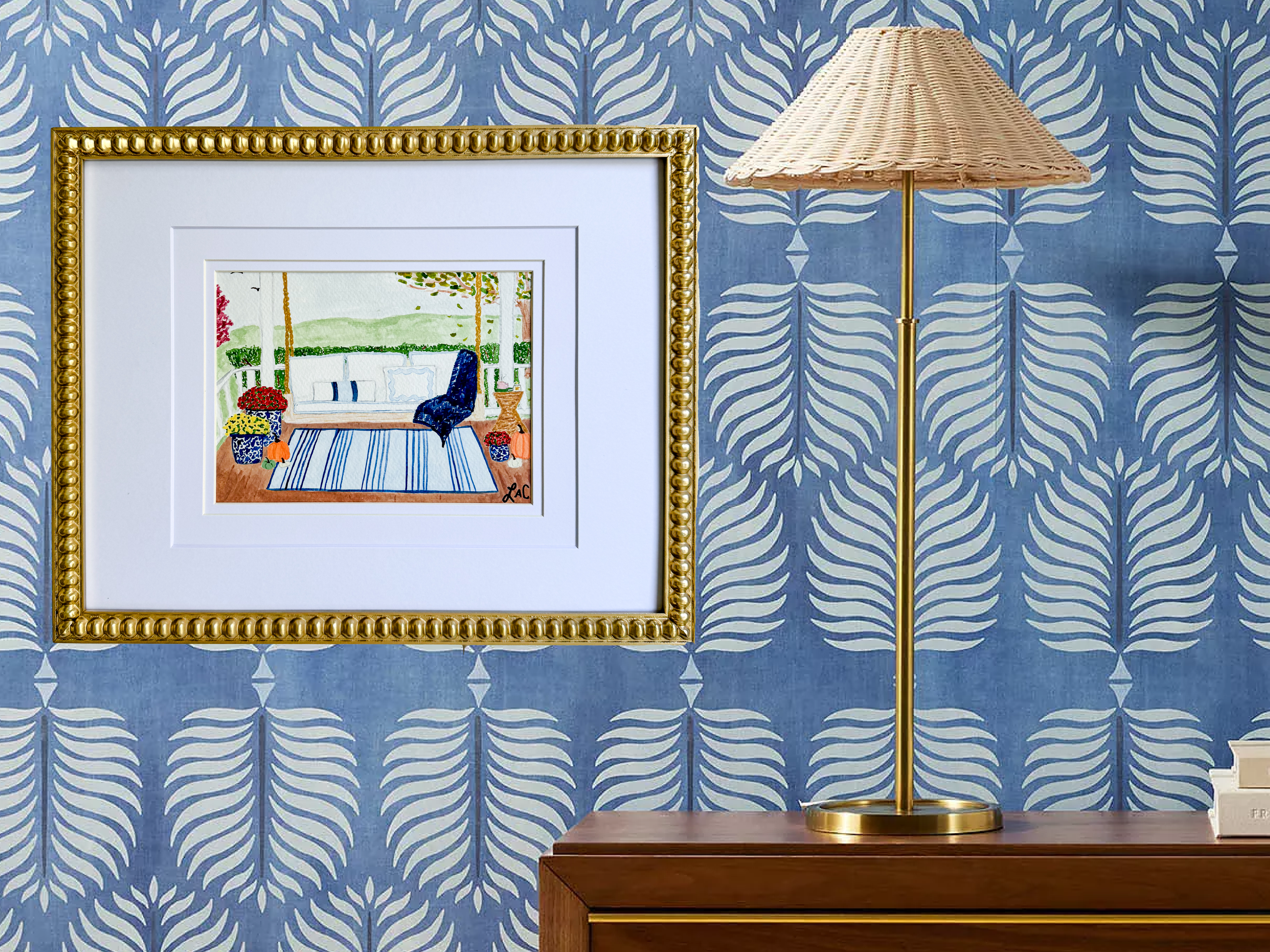 a framed painting of a porch with a swing, a lamp, and a blue and white patterned wall behind it.