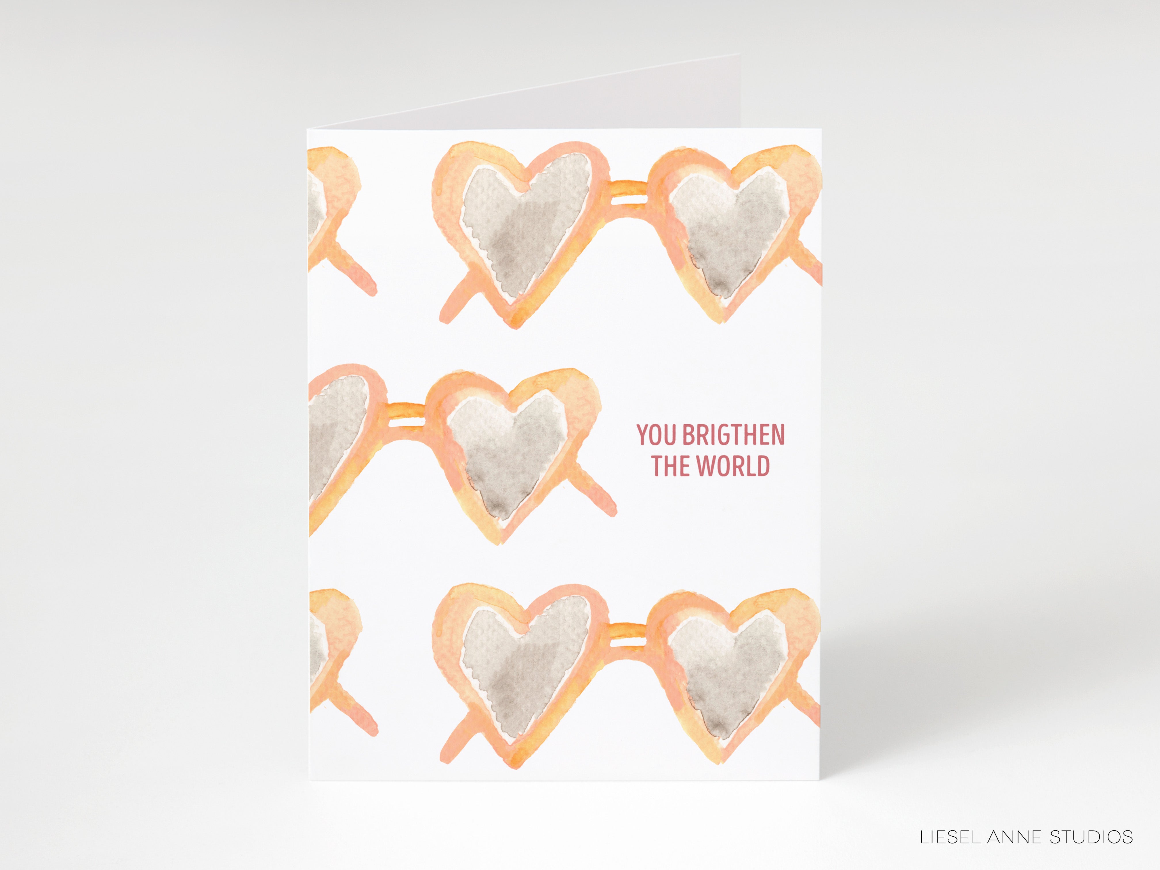 a pair of heart-shaped sunglasses arranged in a repeating pattern.