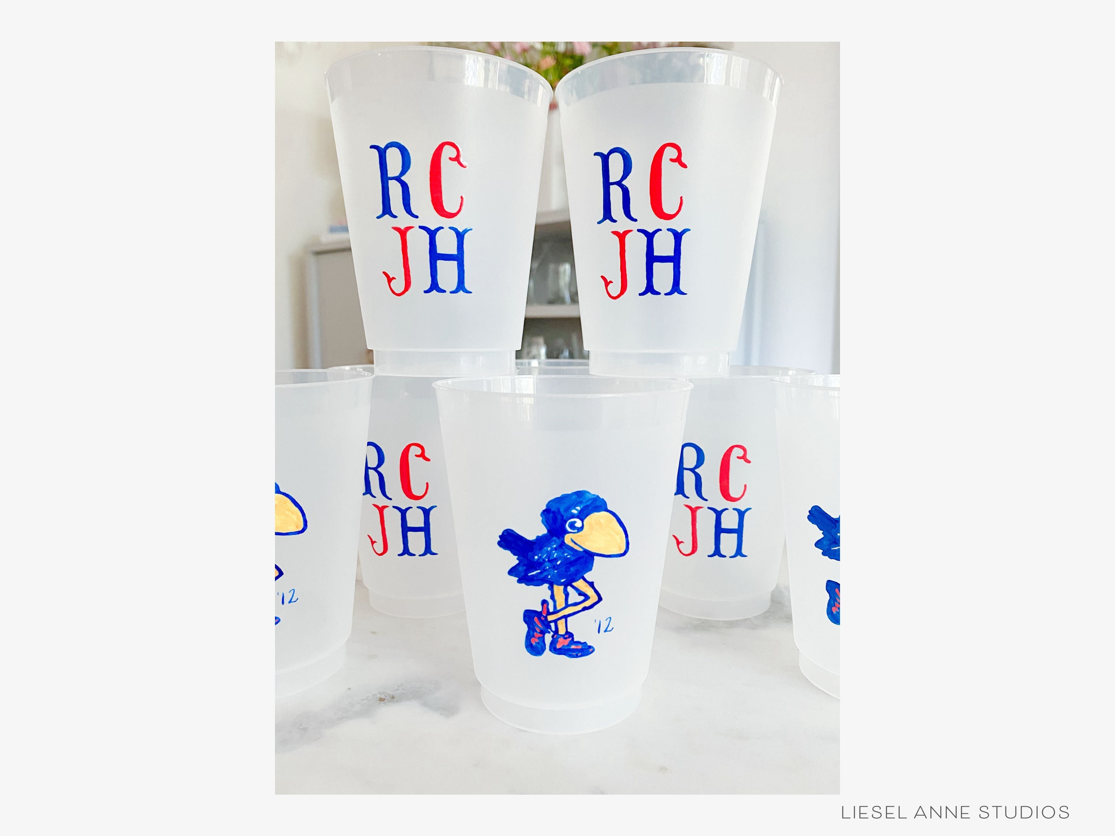 1912 Jayhawk *Officially Licensed* RCJH 16oz Shatterproof Cups (Set of 8)-These officially licensed Kansas Jayhawk shatterproof cups feature our hand-painted 1912 Jayhawk and make great party decorations for watch parties, graduation, game days and more! They come in sets of 8 and are re-usable for other parties to come or make wonderful party favors!-The Singing Little Bird