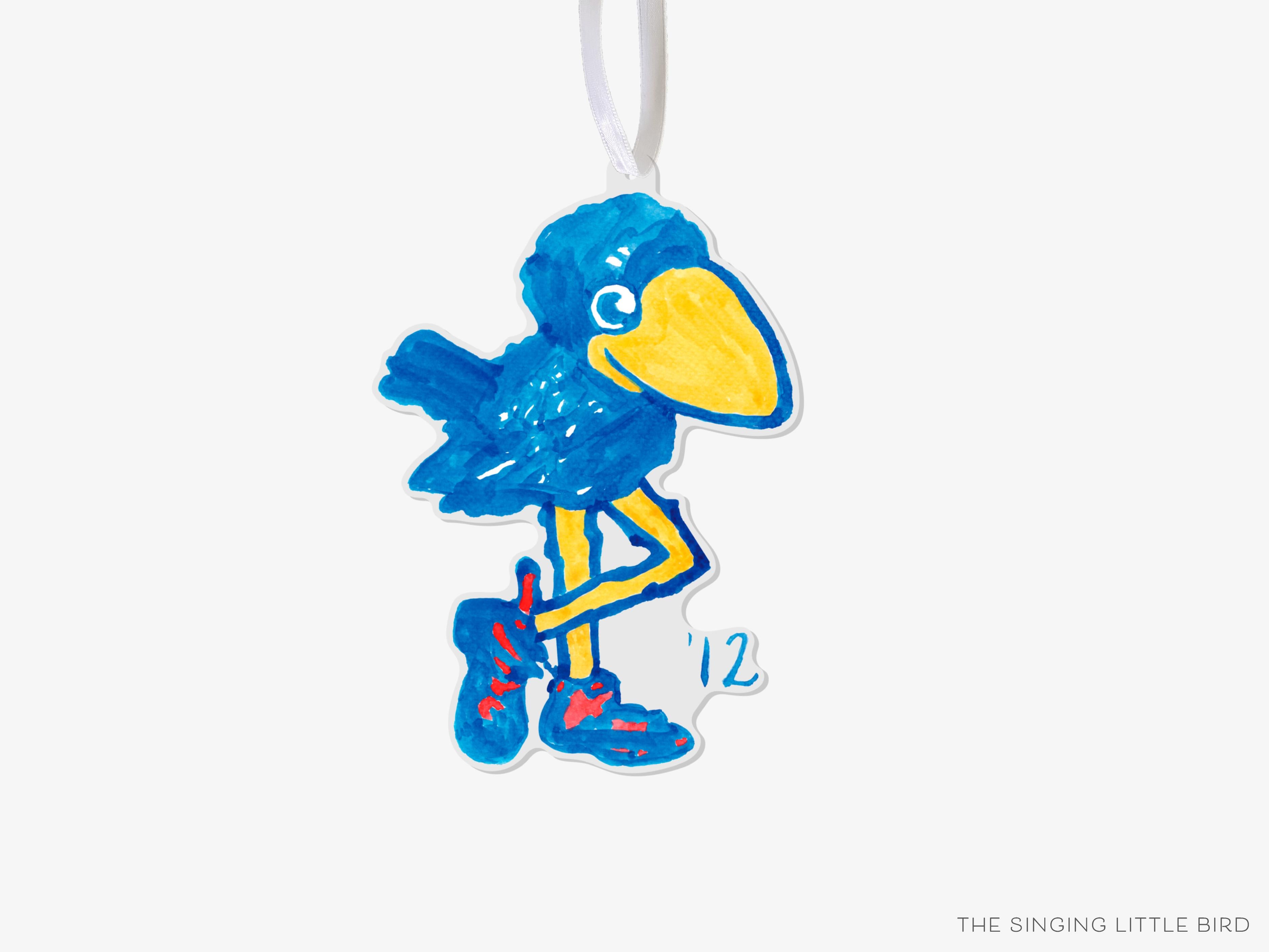 1912 Kansas Jayhawk Acrylic Ornament [Officially Licensed]-These acrylic ornaments feature our hand-painted watercolor 1912 Kansas Jayhawk. They include a white silk ribbon and measure approximately 4" on its longest side, making a great addition to your Christmas tree or gift for the University of Kansas lover in your life.-The Singing Little Bird