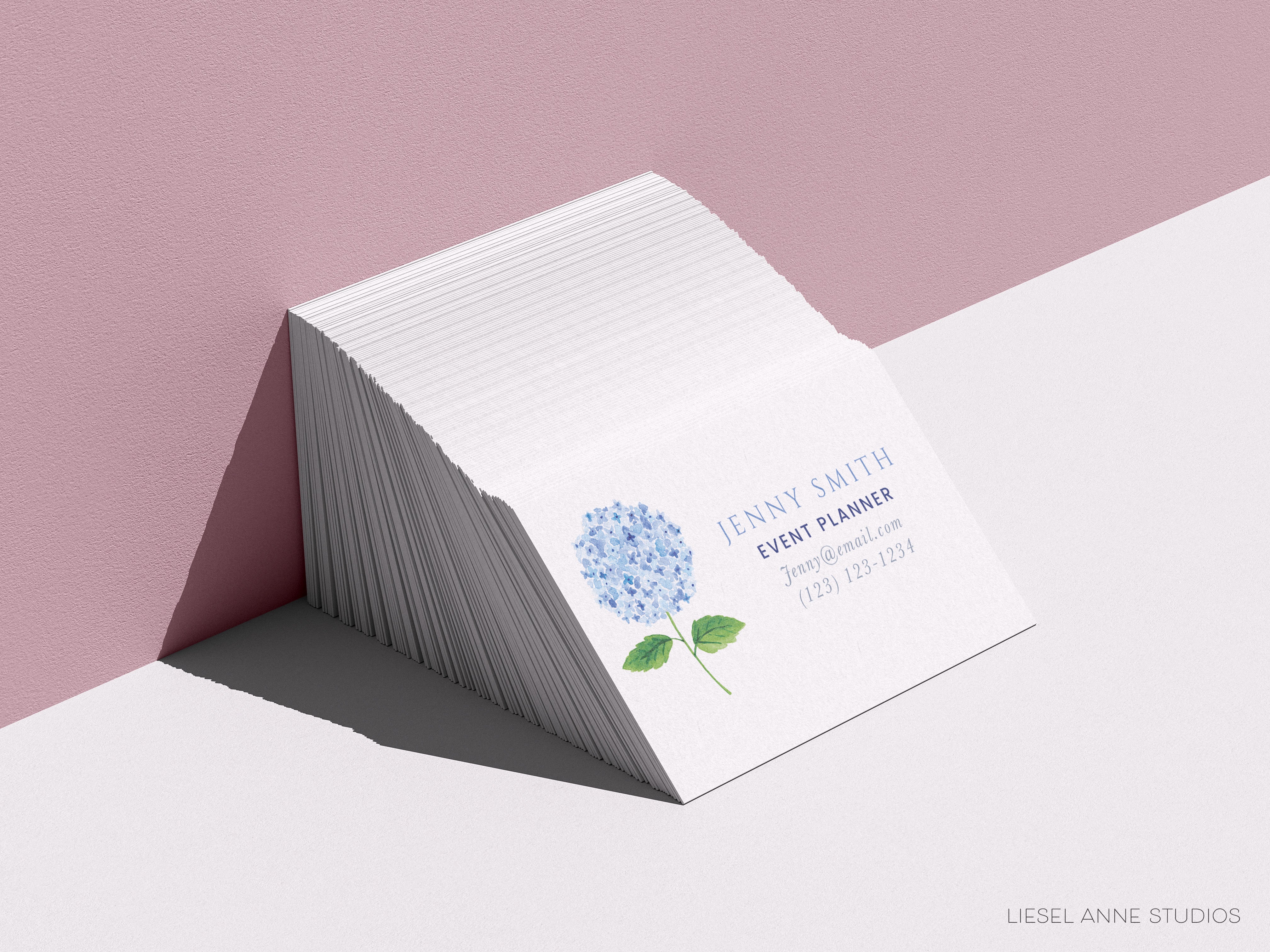 a white business card with a blue flower on it