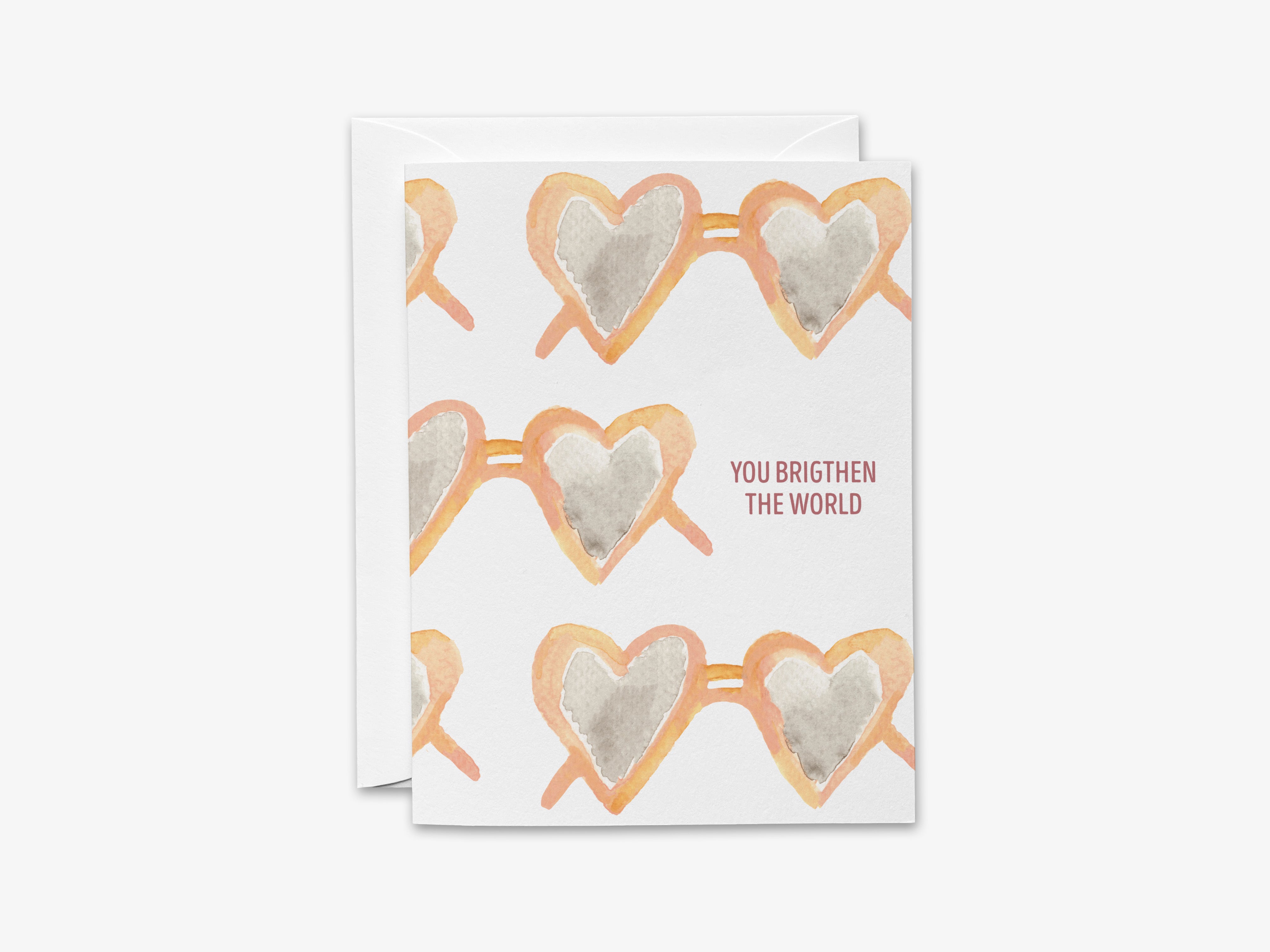 The image is a greeting card with a repeating pattern of heart-shaped sunglasses printed on it.