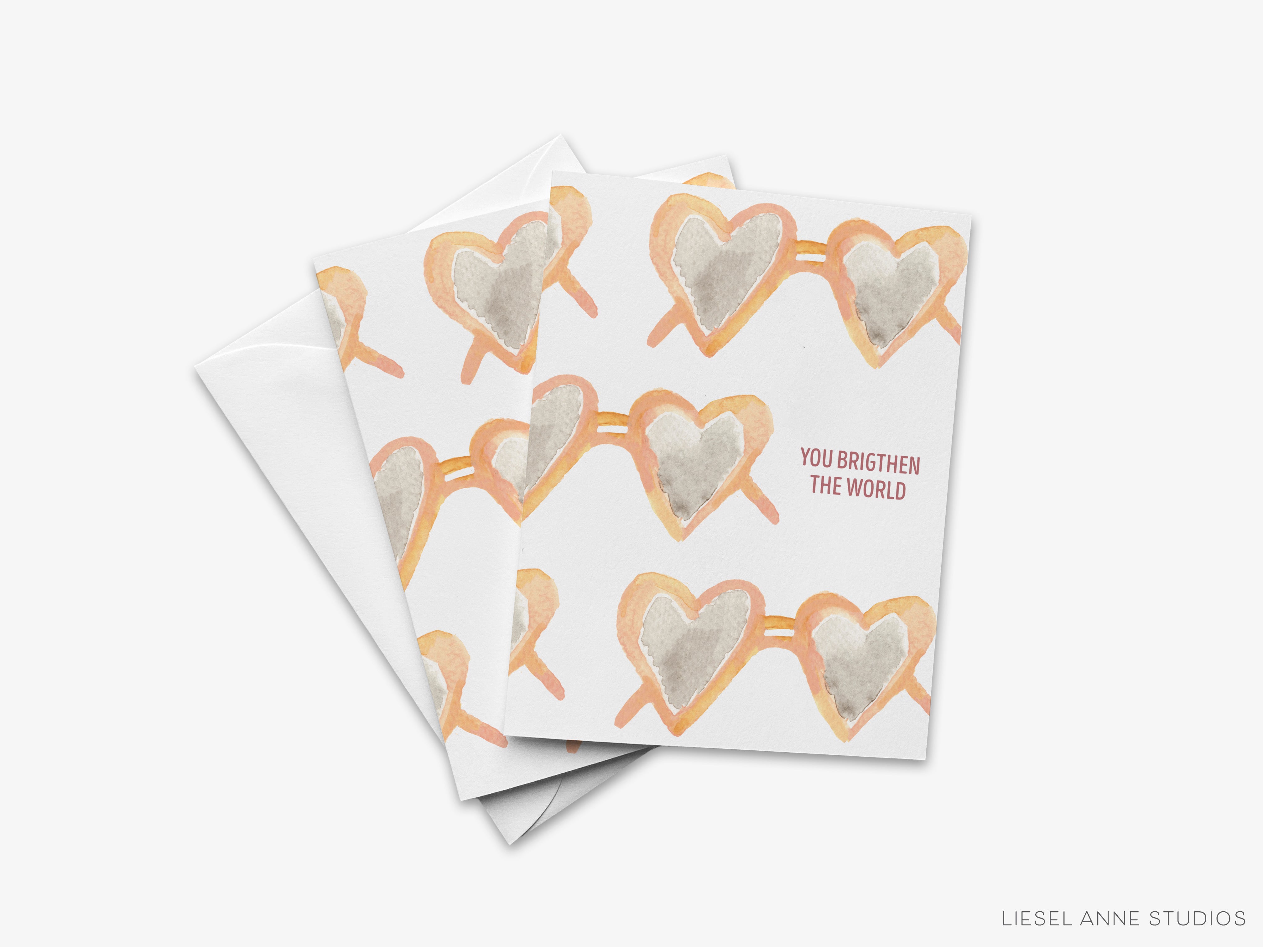 A greeting card with a repeating pattern of heart-shaped sunglasses printed on it.