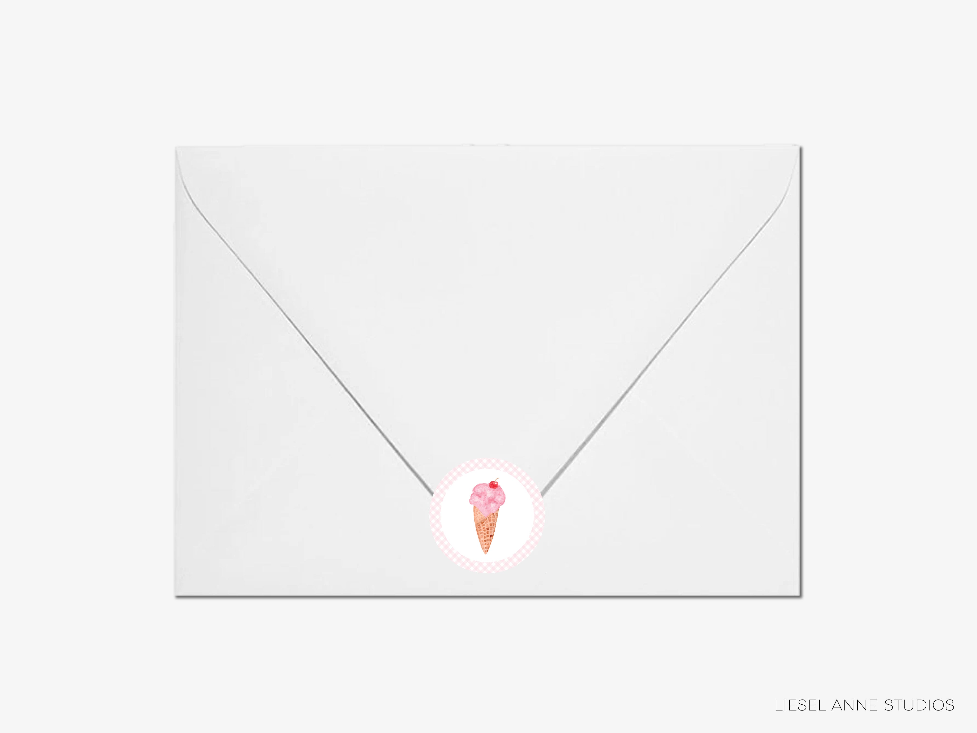 A white envelope with a pink ice cream cone sticker on it.