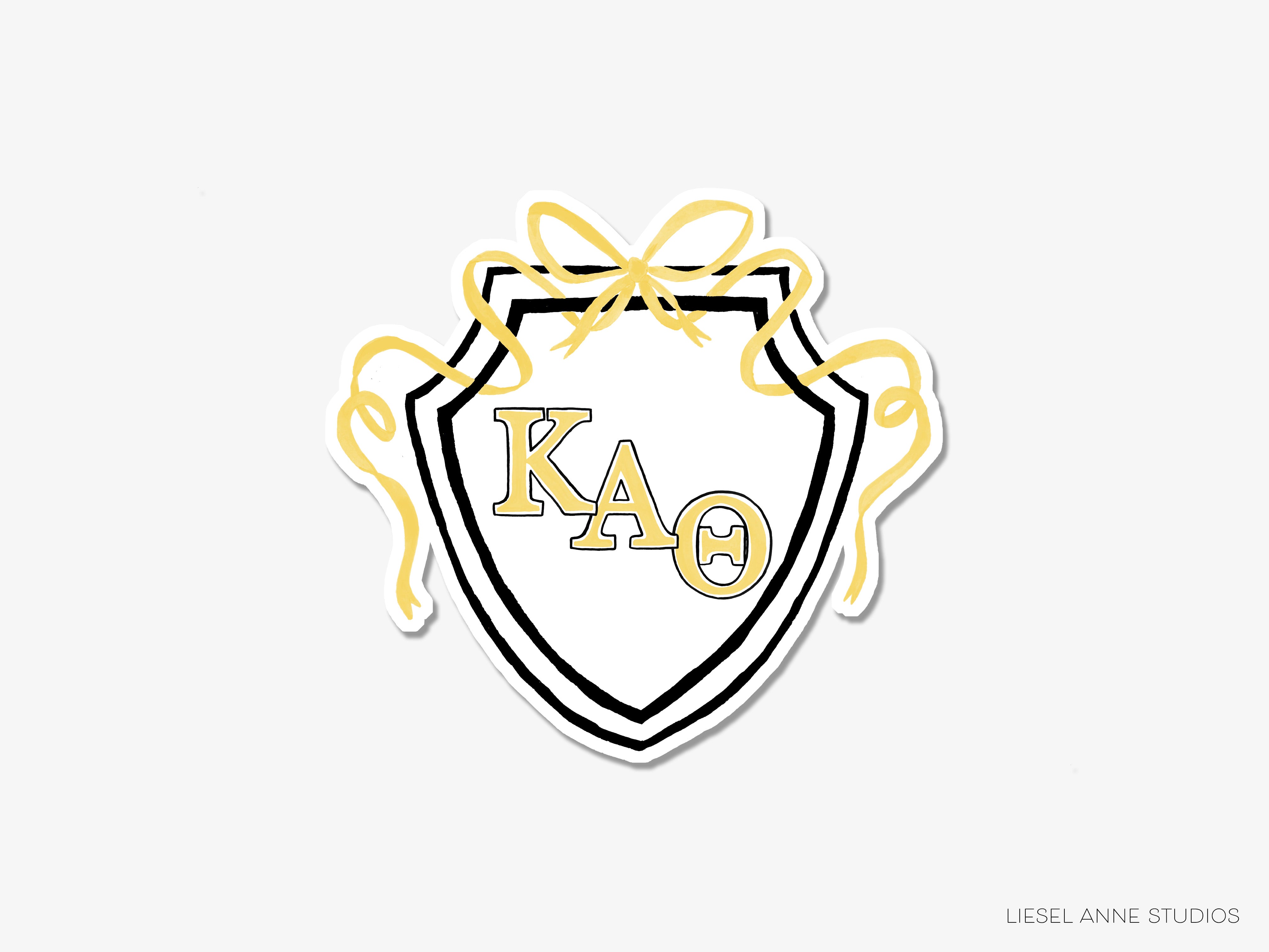 a white and yellow sticker with the letters kao on it