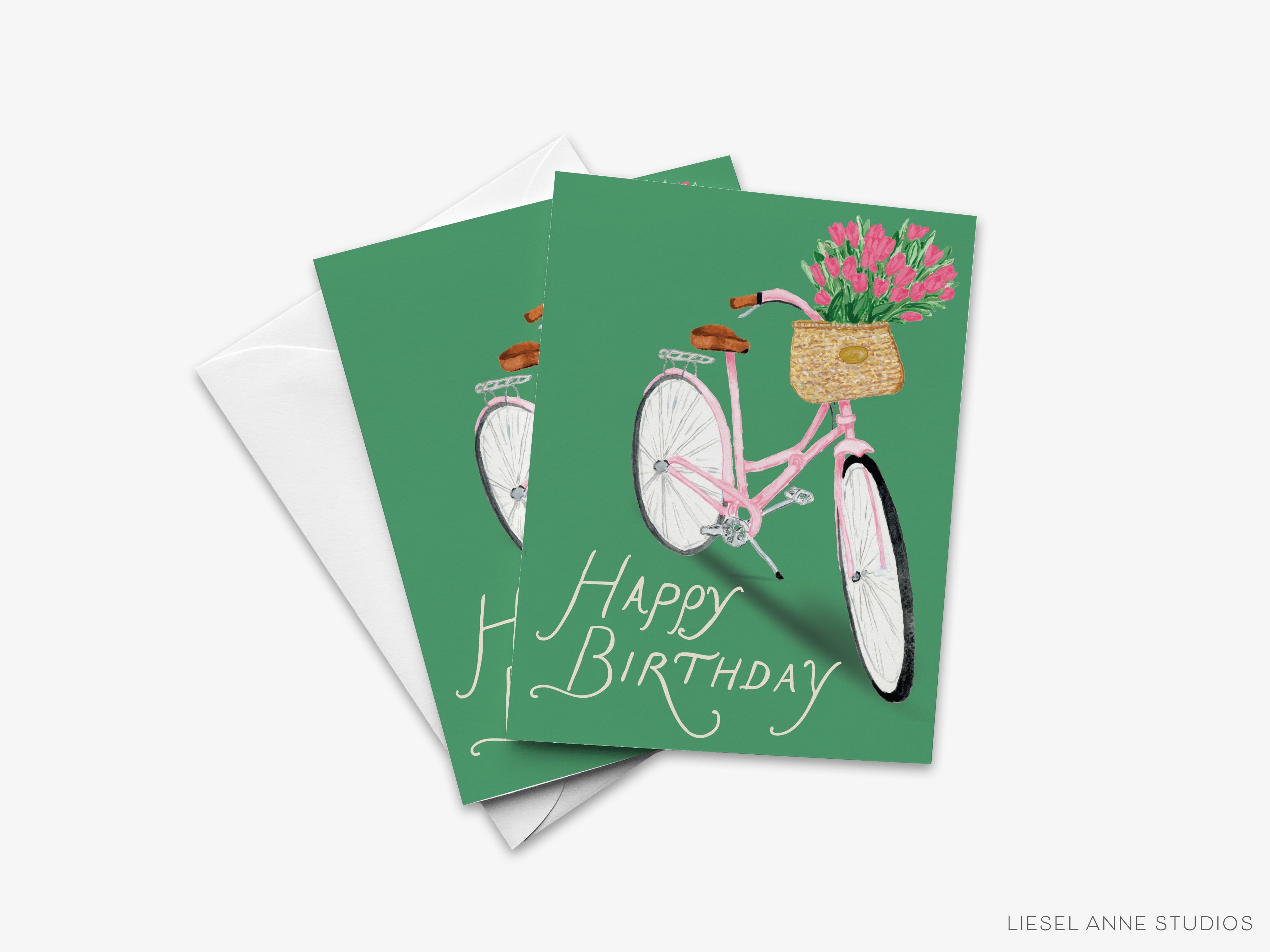 A birthday card with a bicycle and flowers in a basket, along with the text "Happy Birthday".