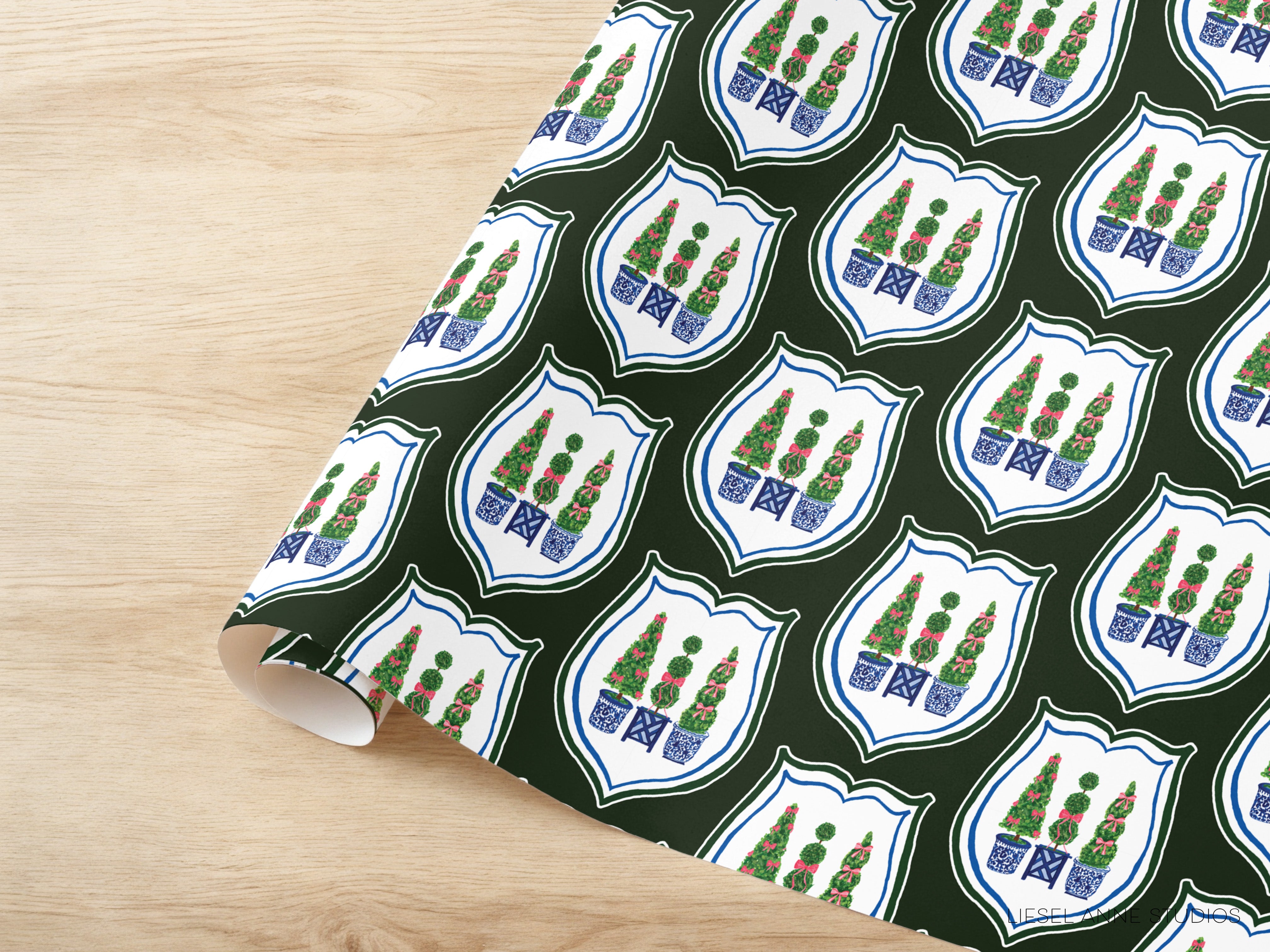 a repeating pattern of shield-shaped designs with green trees and blue pots, creating a visually appealing and cohesive design.