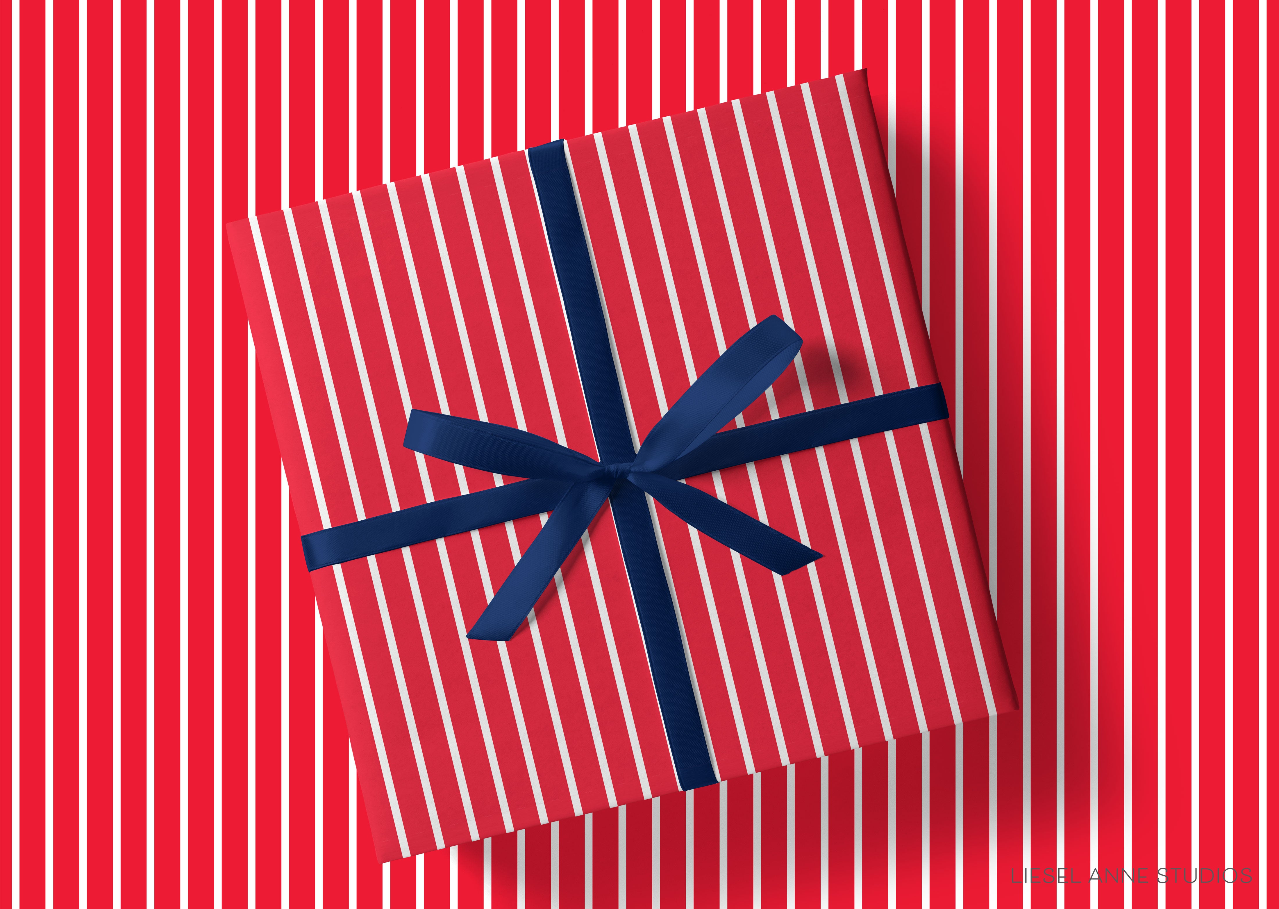 A red gift box with a blue ribbon tied around it, placed against a background of red and white striped patterns.