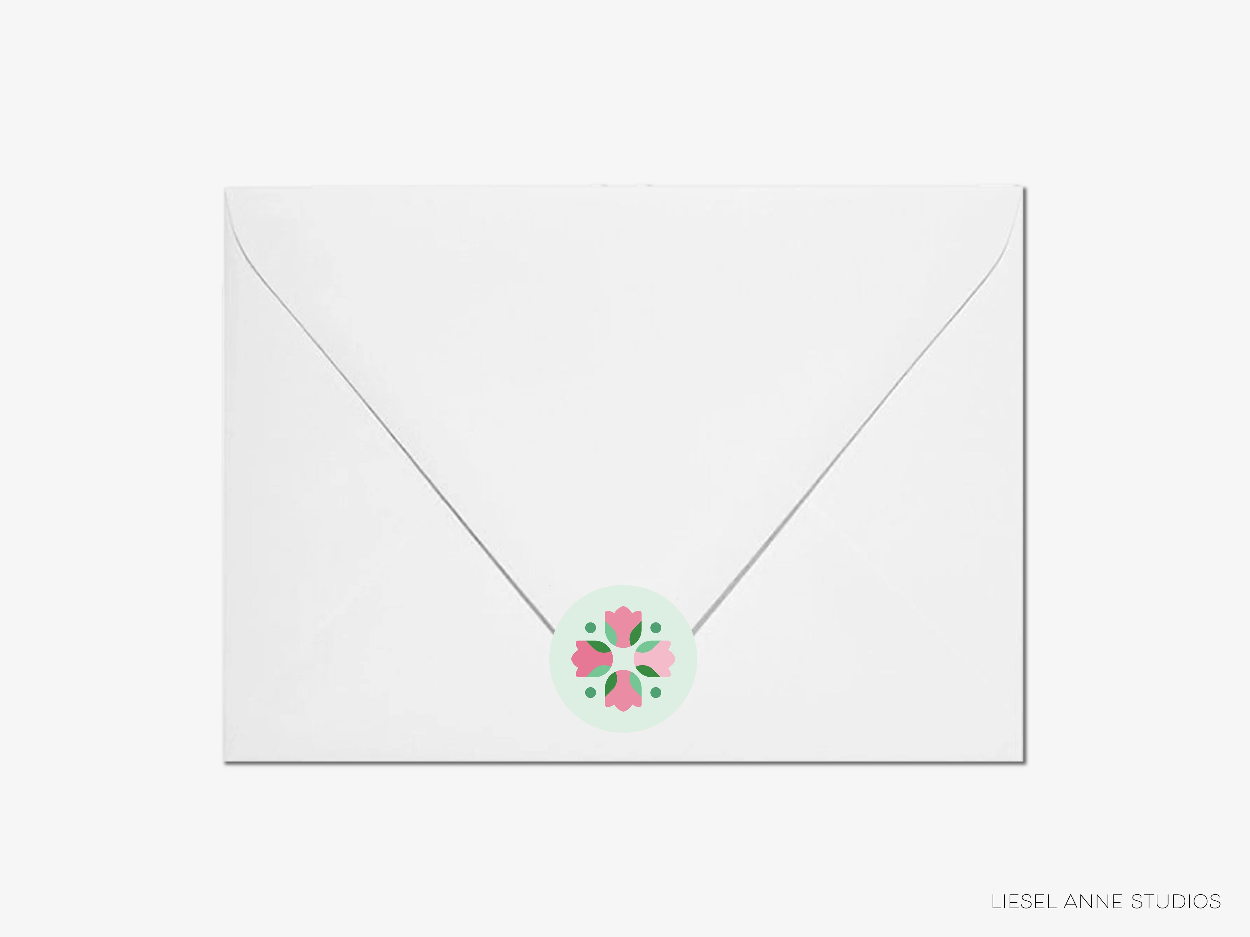 A white envelope with a floral design on the flap.