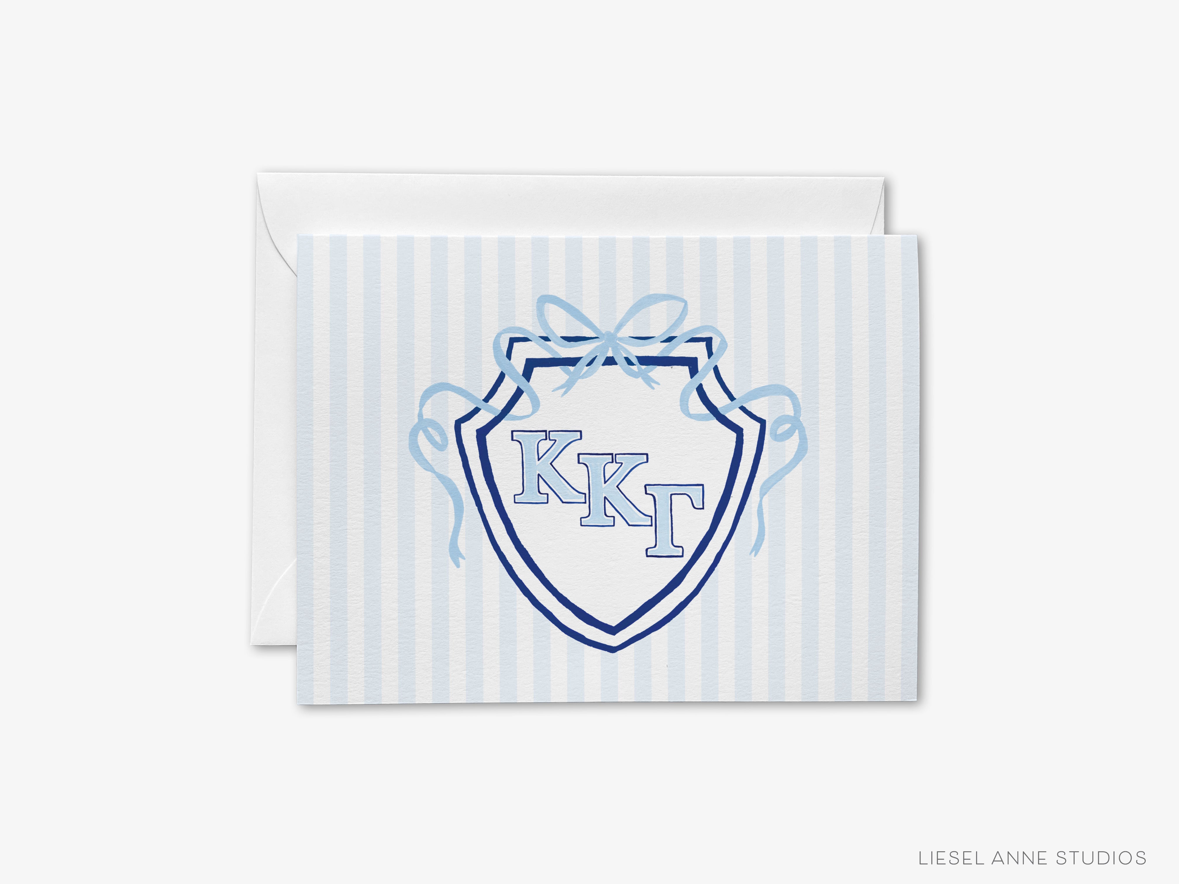 A greeting card with a blue and white striped background and a shield-shaped logo featuring the letters 'KKT' in the center.