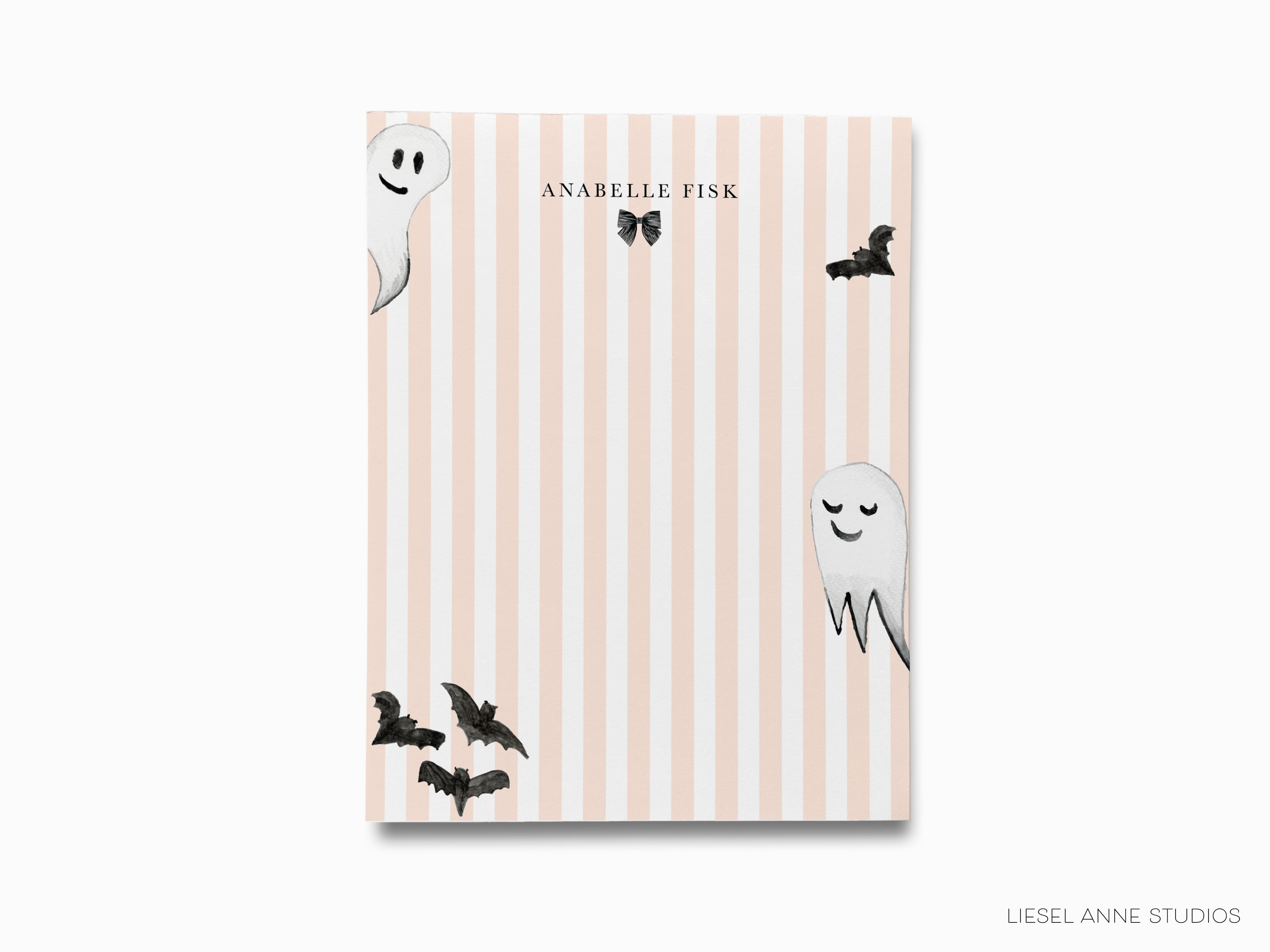 a pink and white striped background with three ghostly figures and bats.