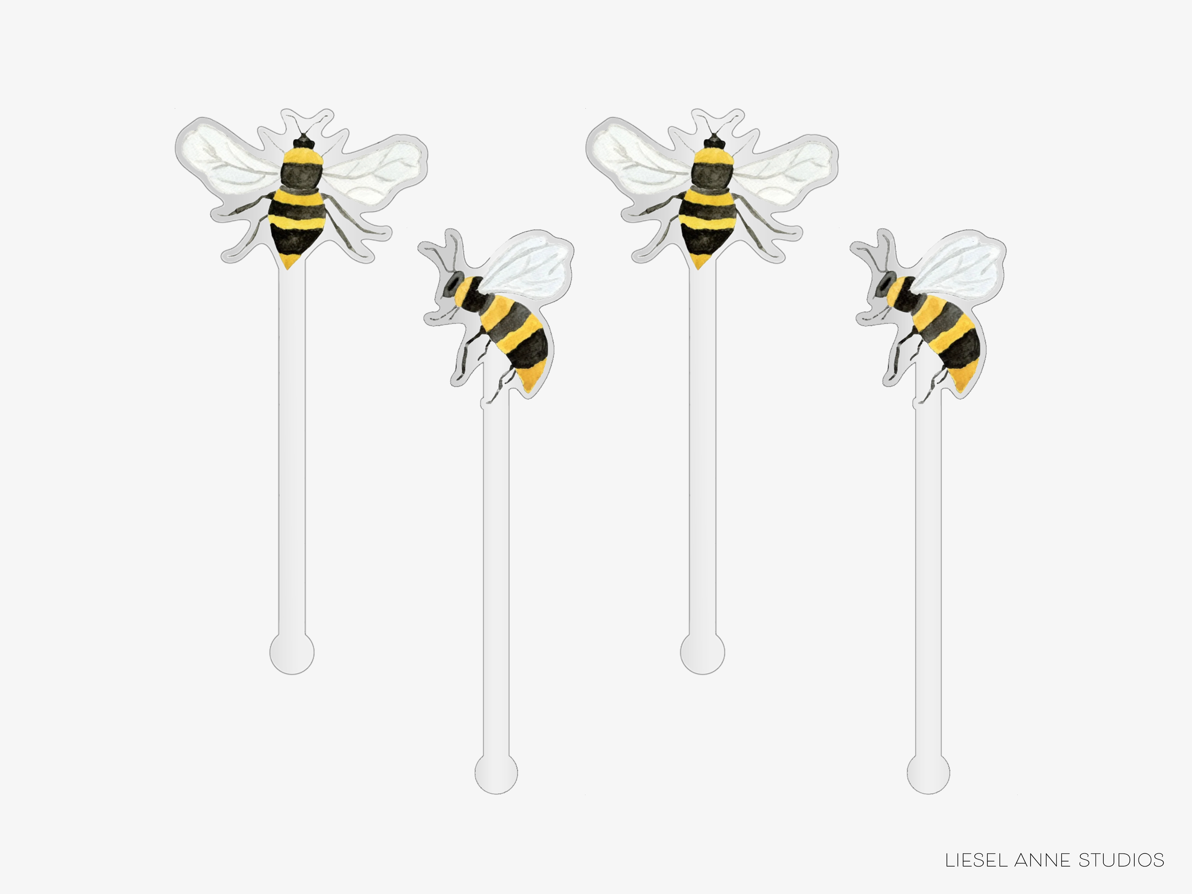four straws with bee-like designs on them.