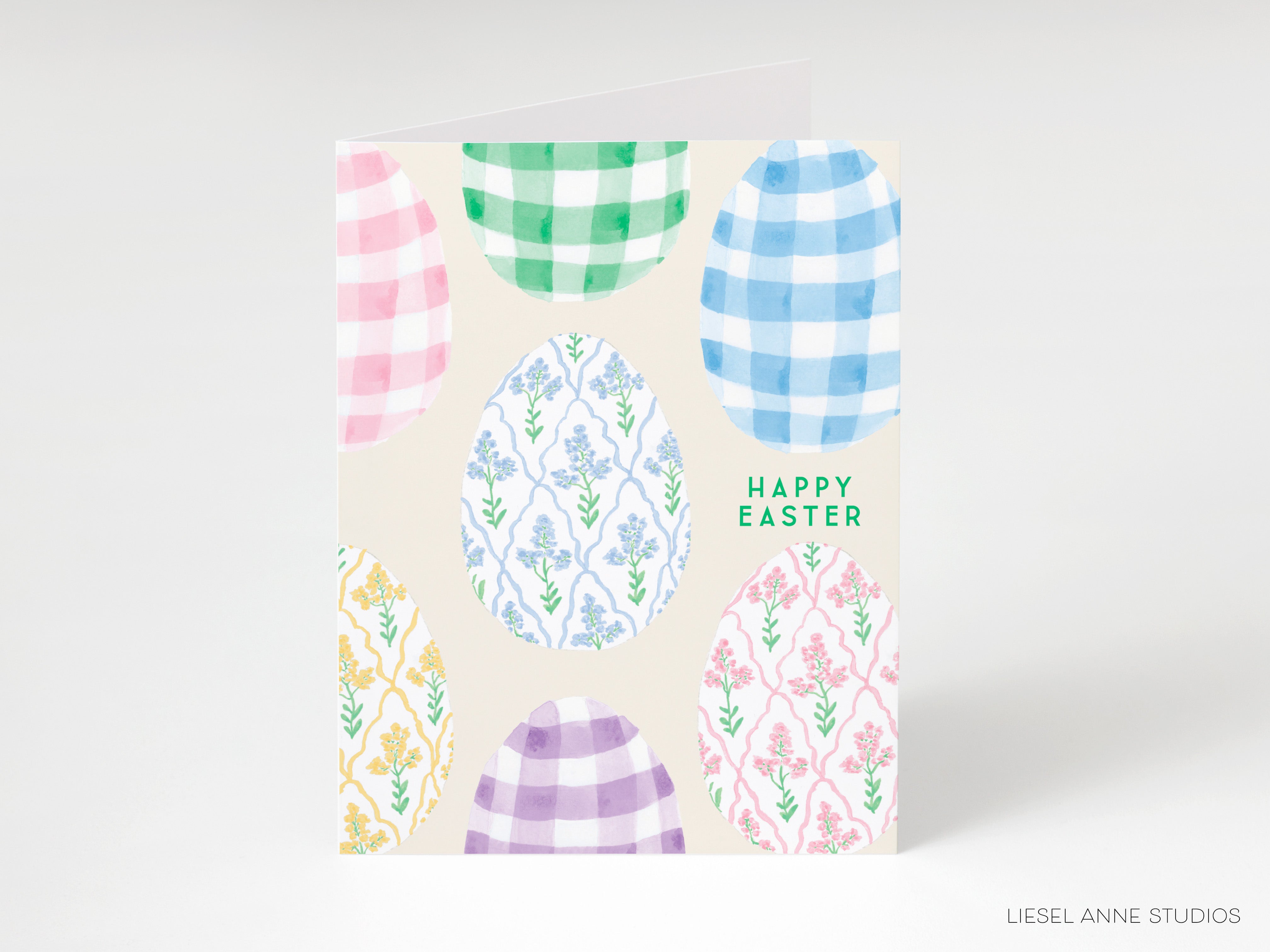 A greeting card with a colorful Easter egg design and the text "Happy Easter" printed on it.