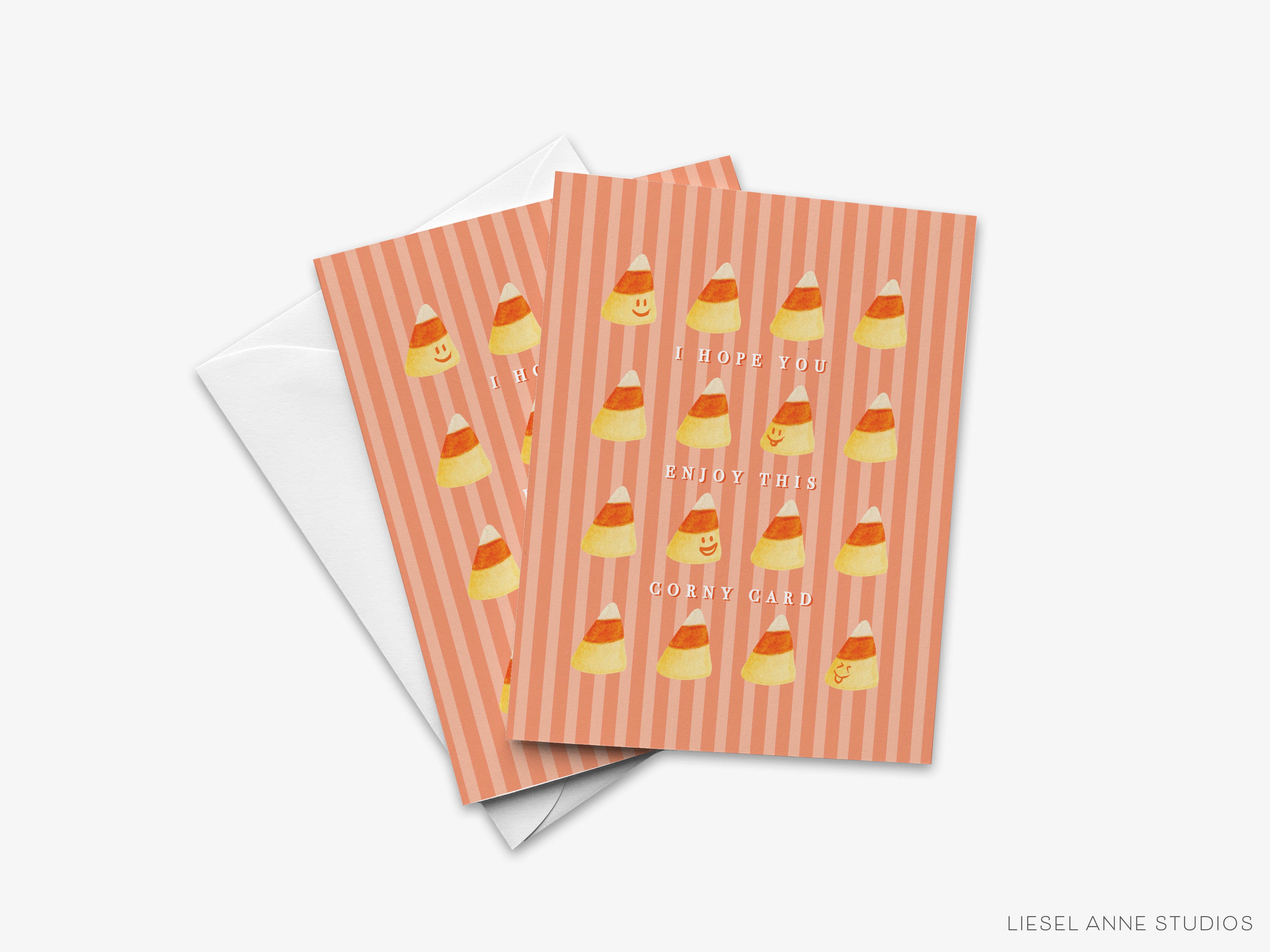 The image is a greeting card with a playful design featuring candy corn illustrations. The card has a striped pattern and the phrase "I hope you enjoy this corny card" written on it.