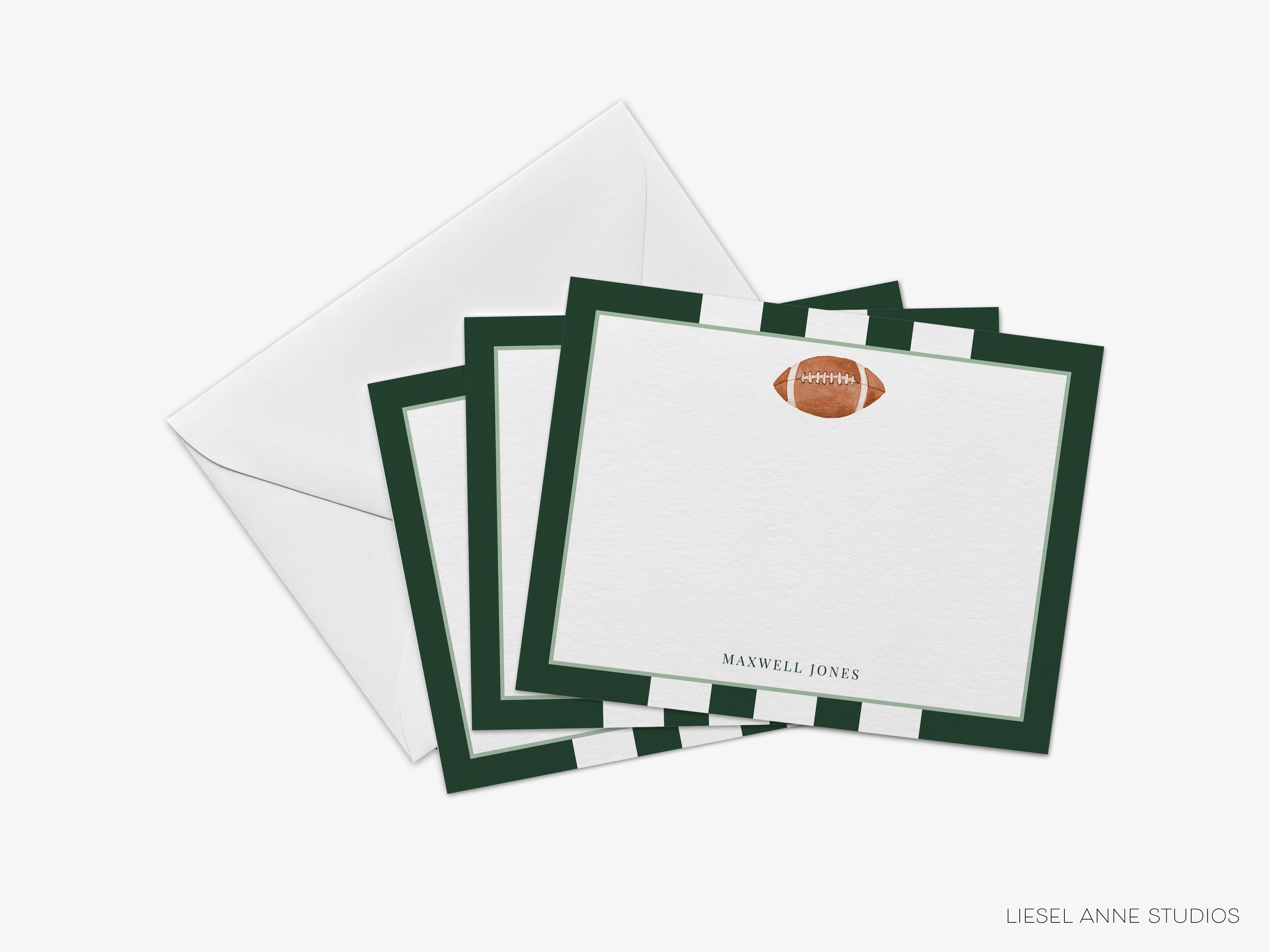 a set of green and white football-themed stationery cards with a football image on the front, placed on top of an envelope.