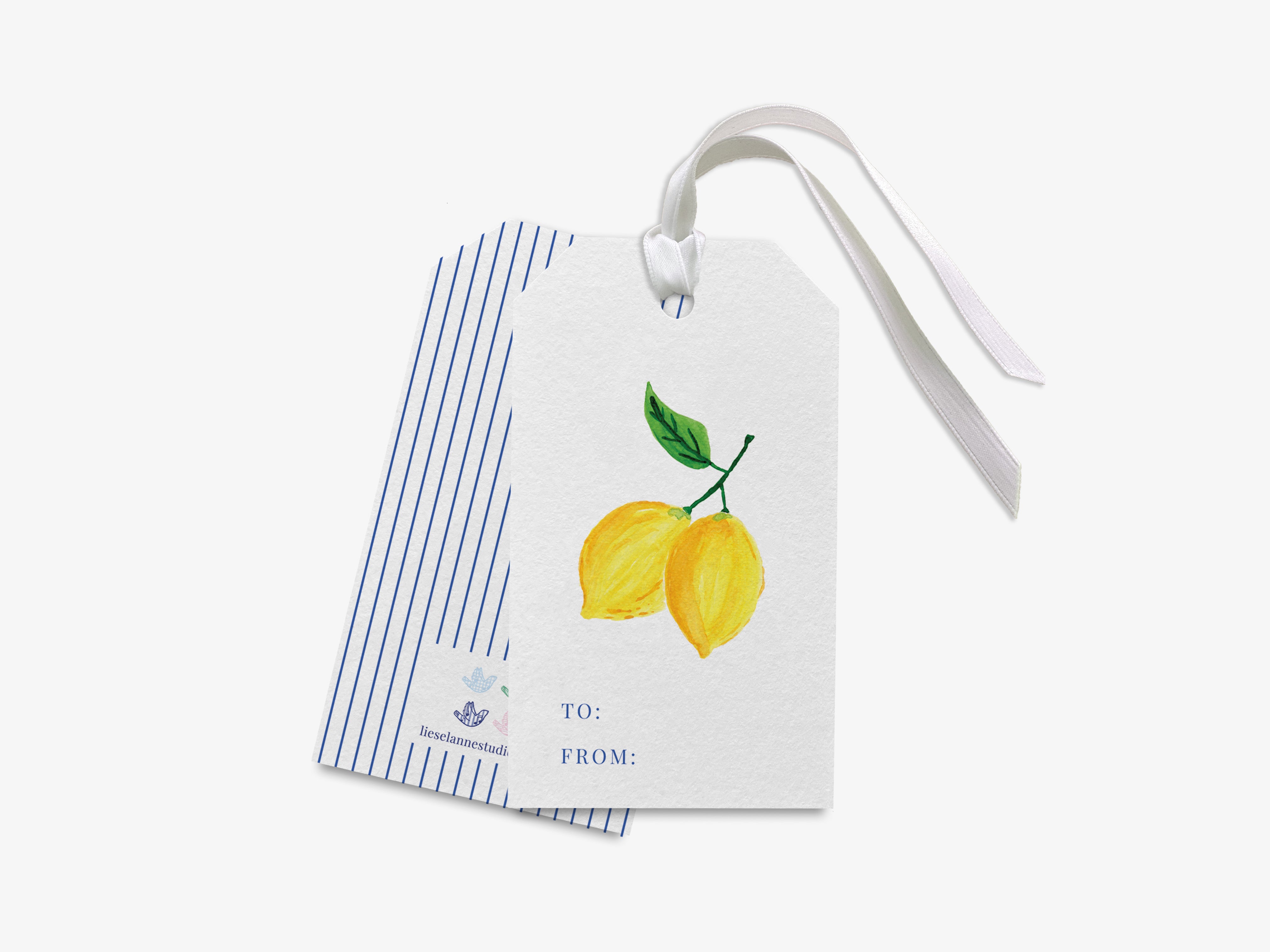 a white gift tag with a blue stripe and a yellow lemon illustration on it.