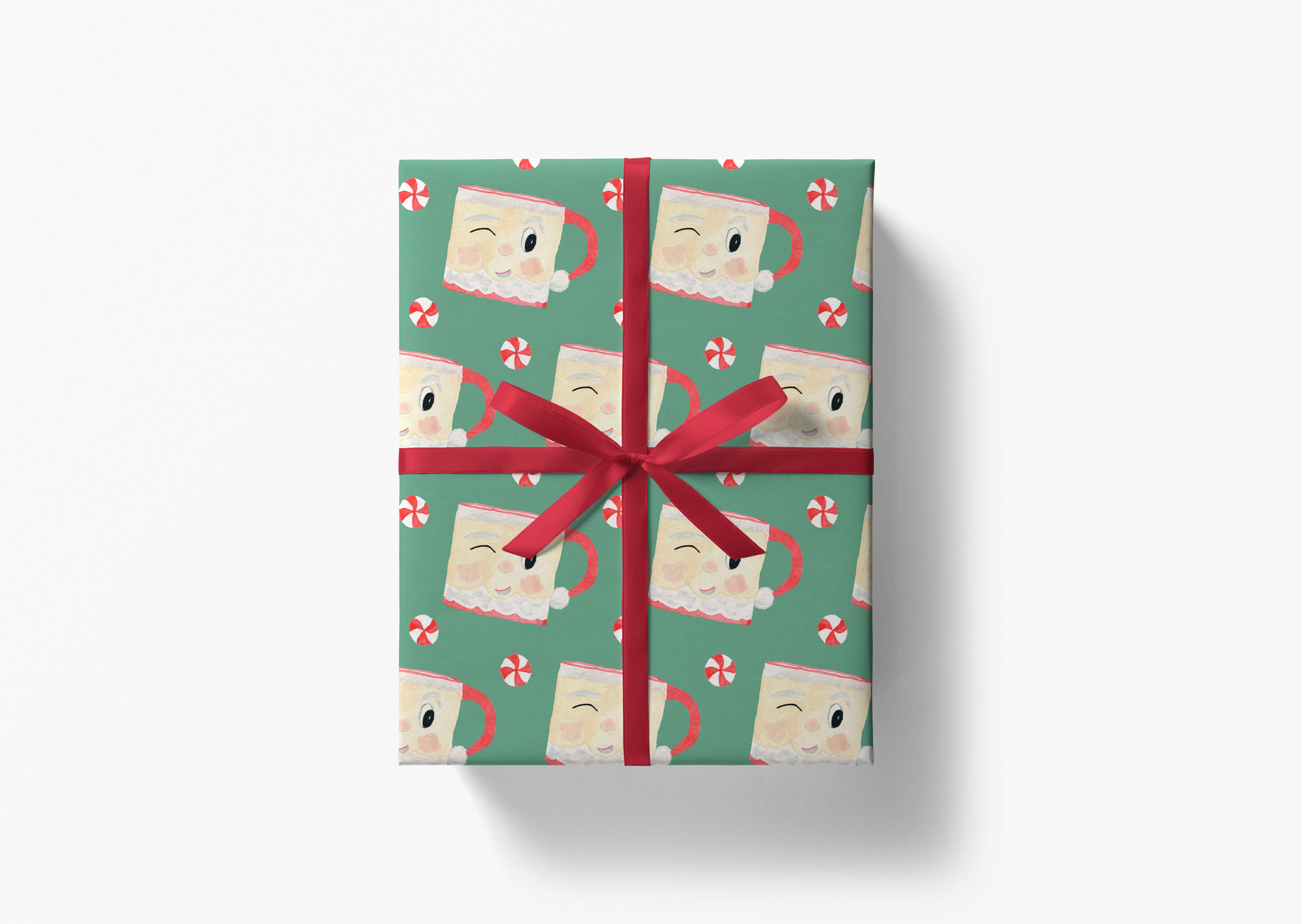 A gift box with a red ribbon tied around it, decorated with a repeating pattern of smiling faces and candy canes.