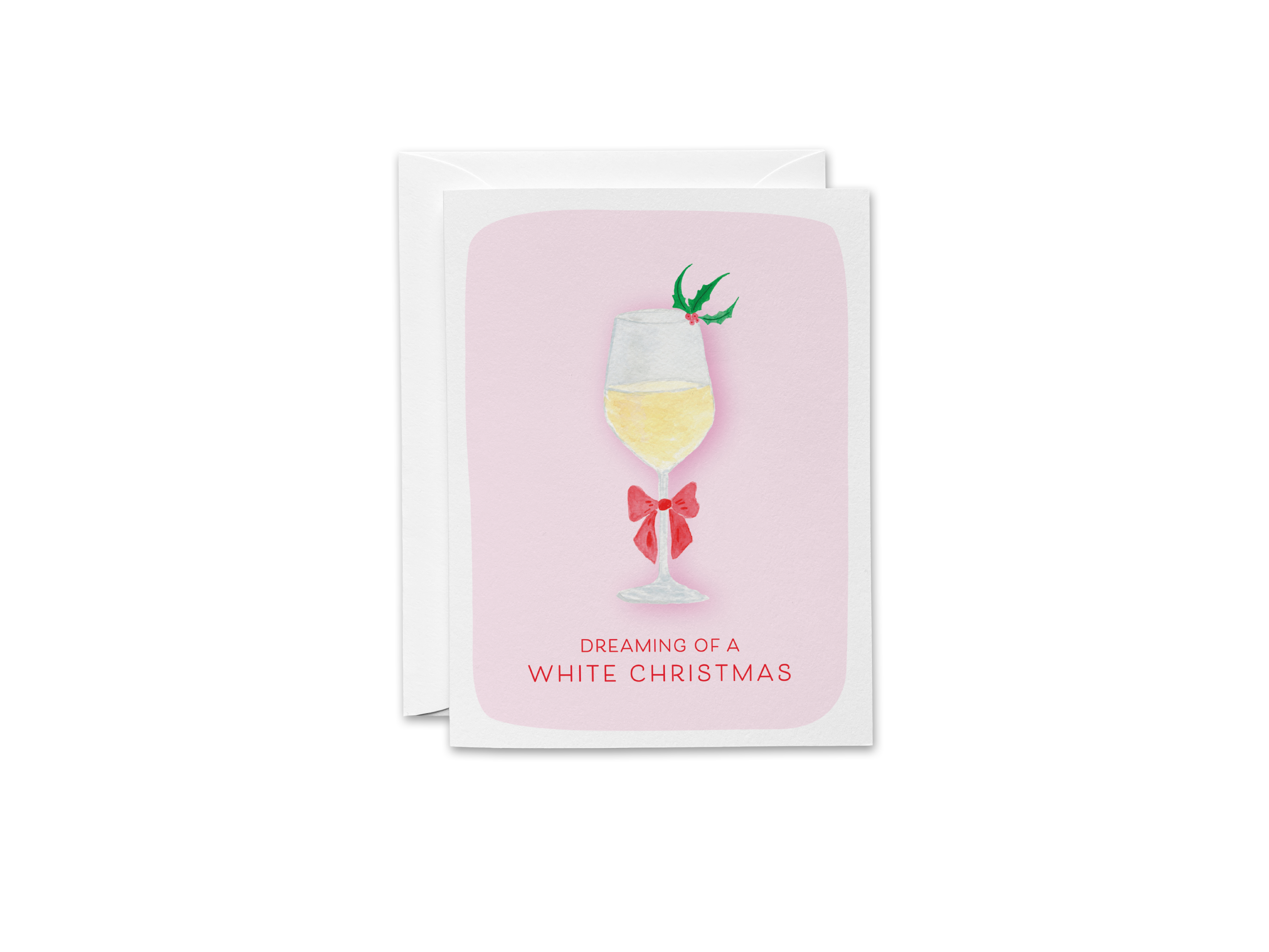 A greeting card with a pink background and a white wine glass with a bow on it. The text on the card reads "DREAMING OF A WHITE CHRISTMAS".