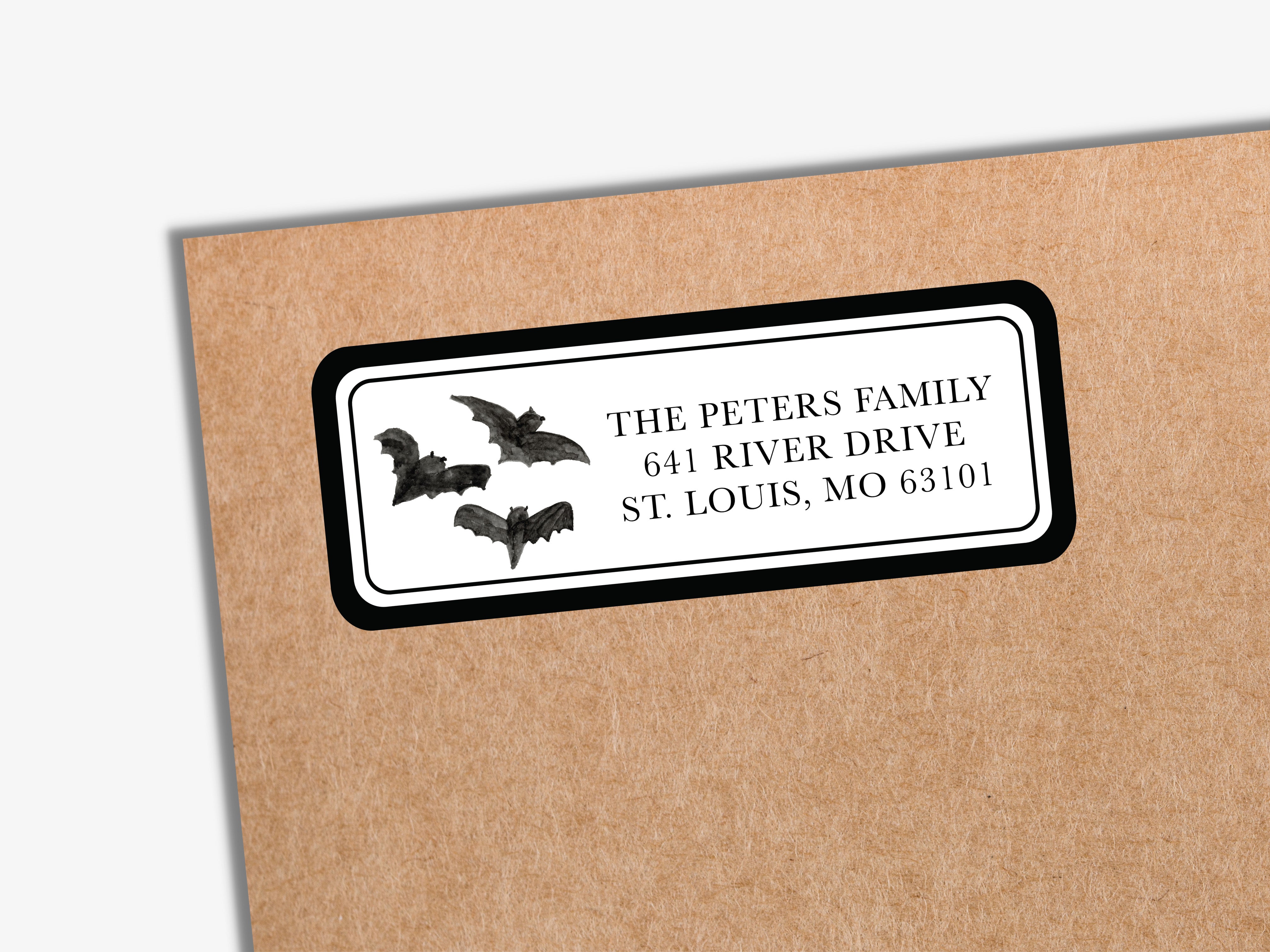 a label with a bat illustration on it, placed on a brown envelope.