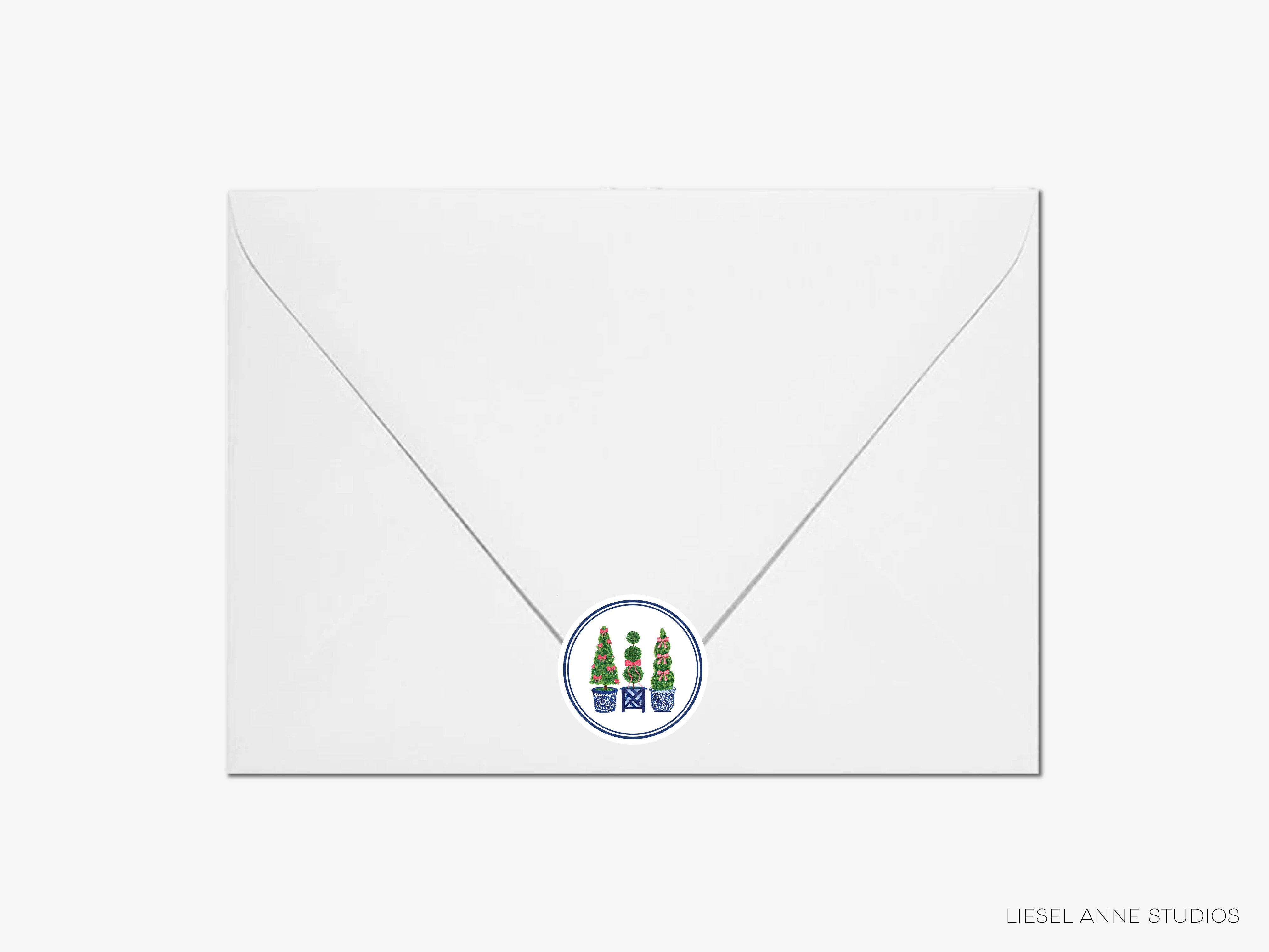 A white envelope with a circular blue and green stamp featuring a design of three trees.