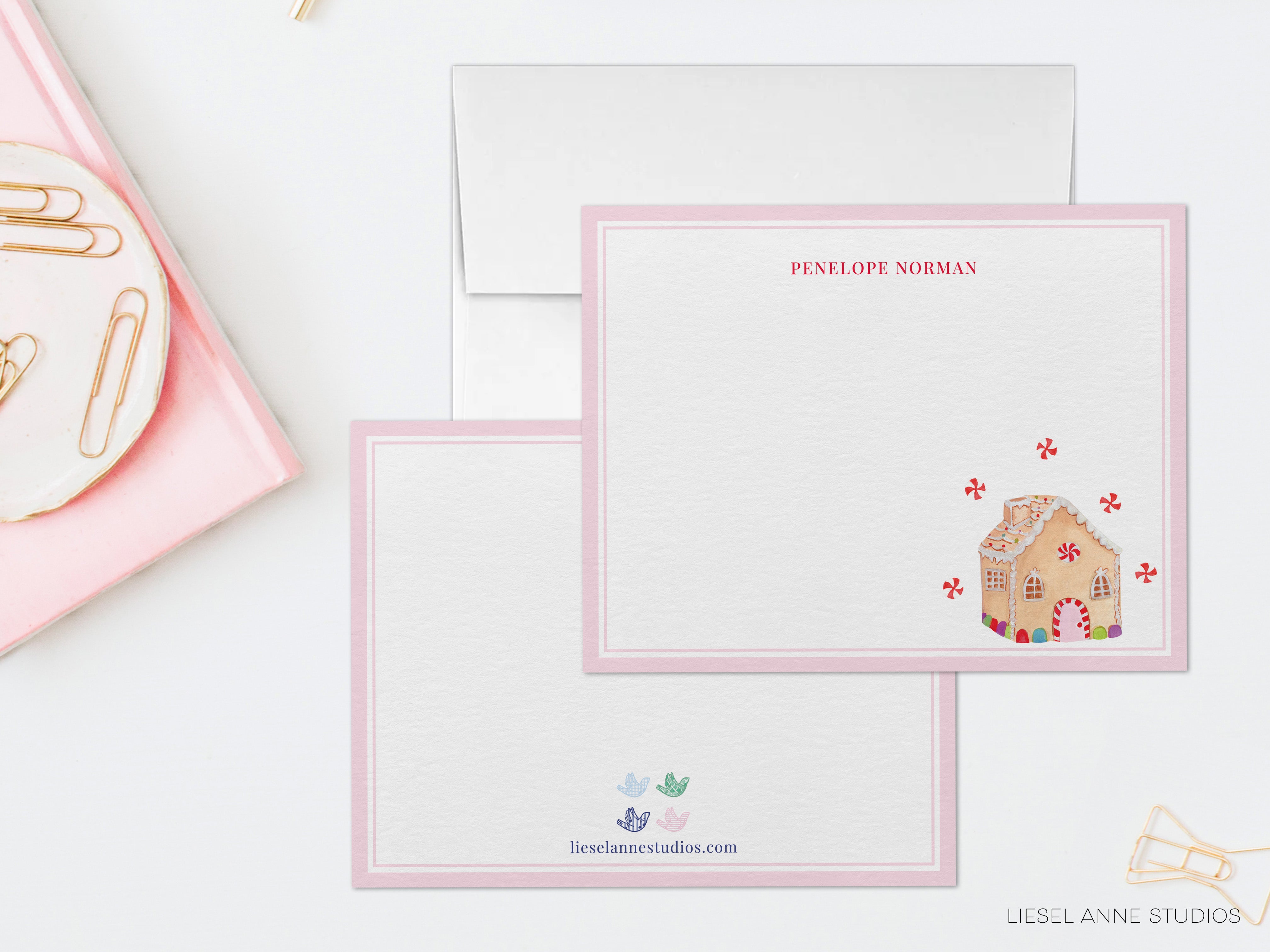 a card with a gingerbread house on it