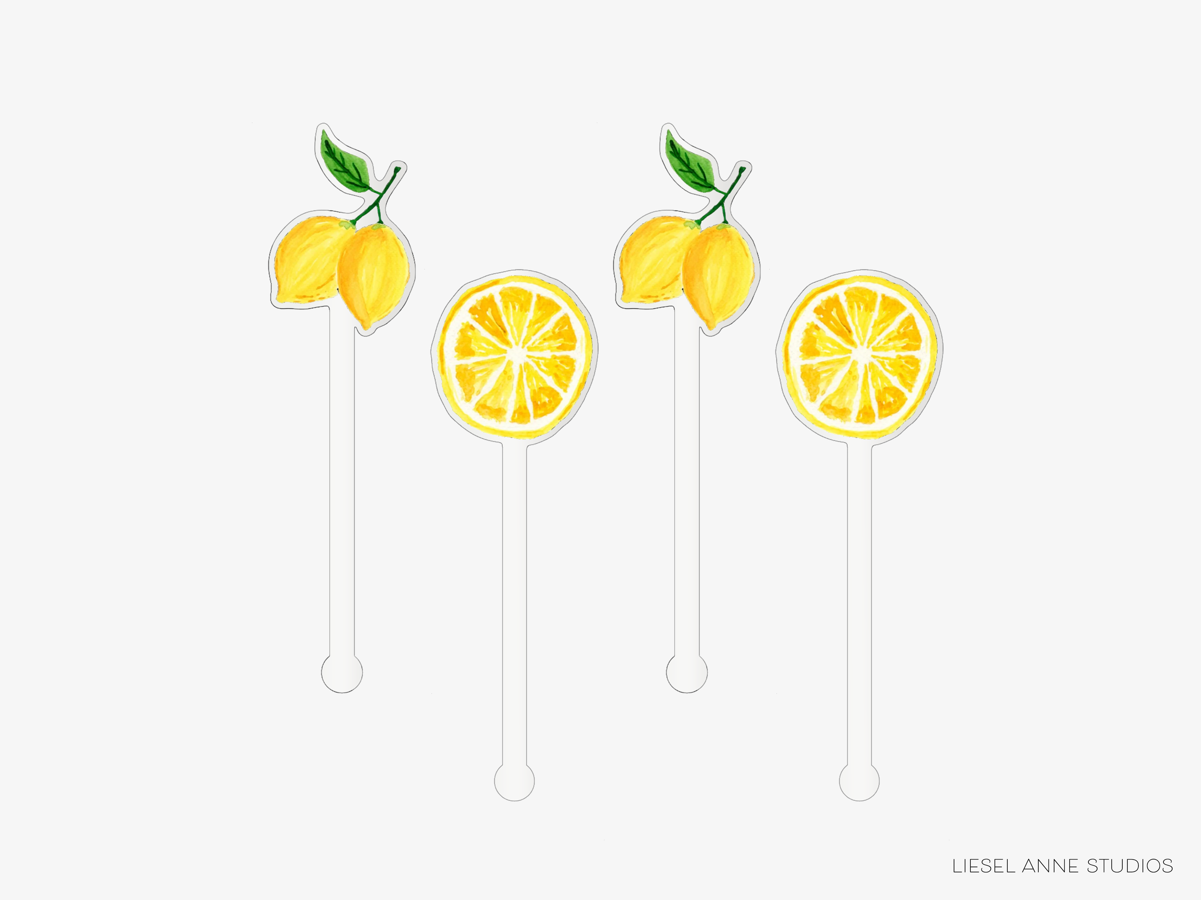 three lemon-shaped cocktail stirrers with lemon slices on them.
