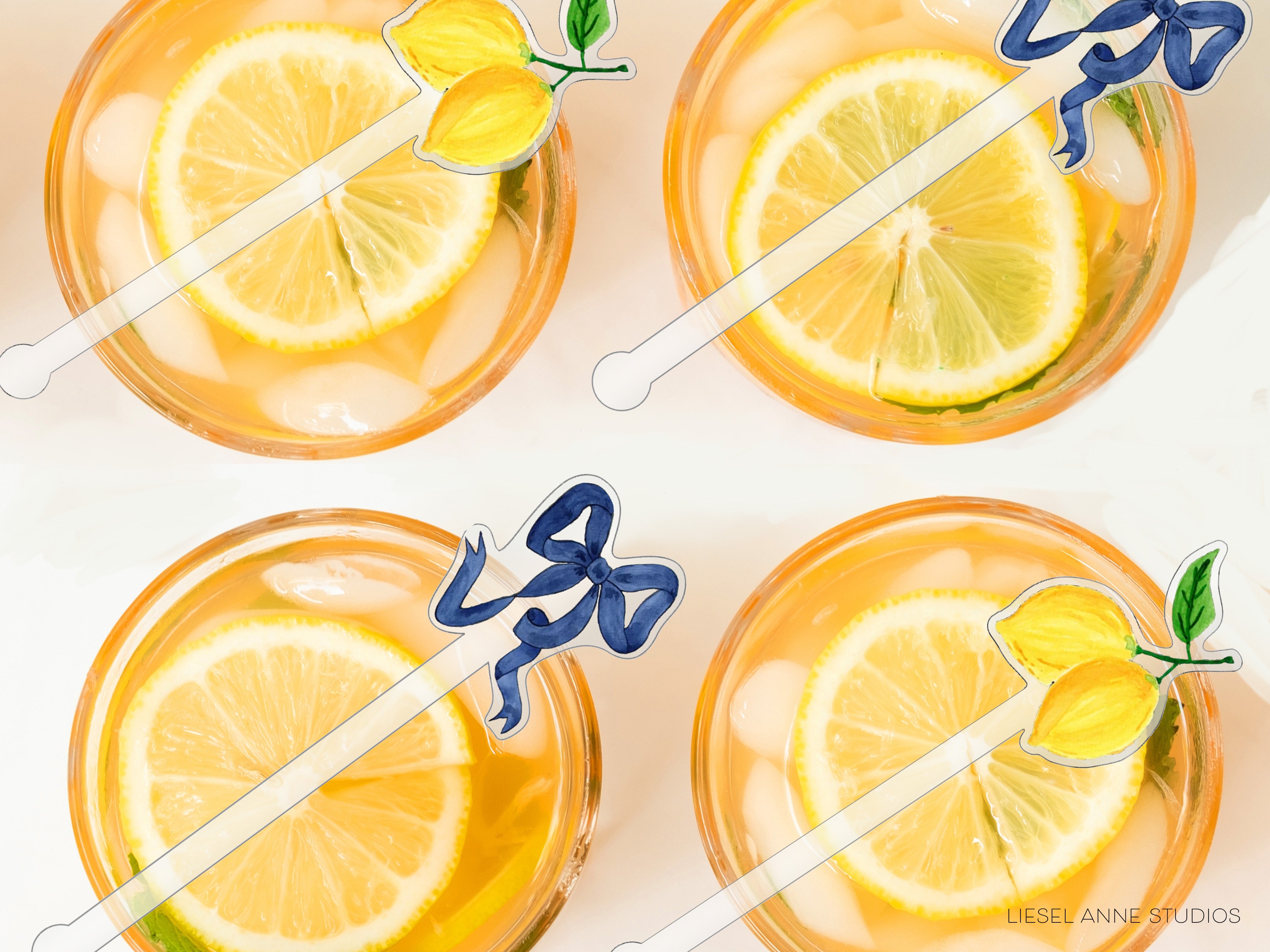 four glasses filled with a yellow liquid, each containing a slice of lemon and a blue ribbon.