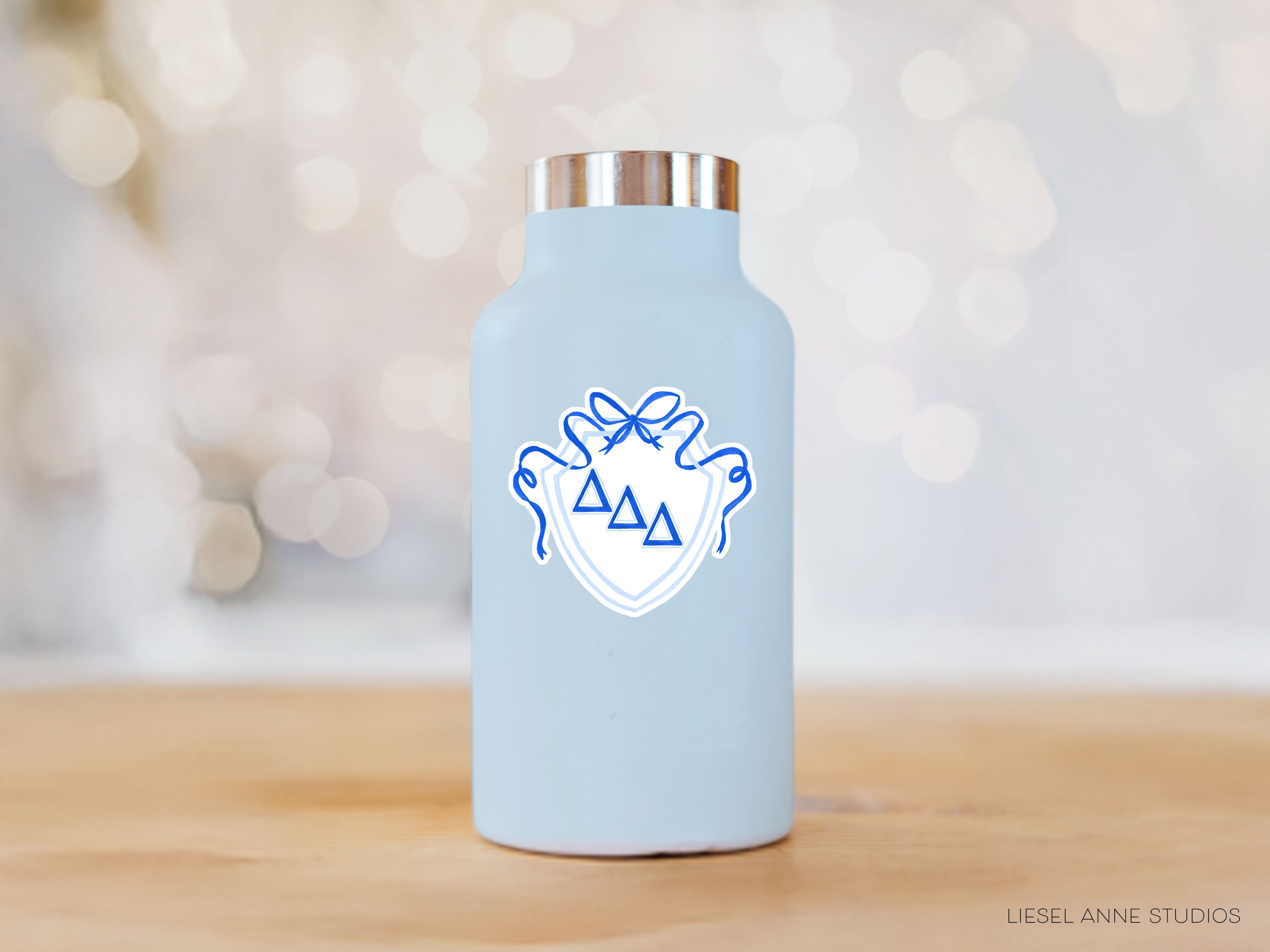 a blue water bottle sitting on top of a wooden table