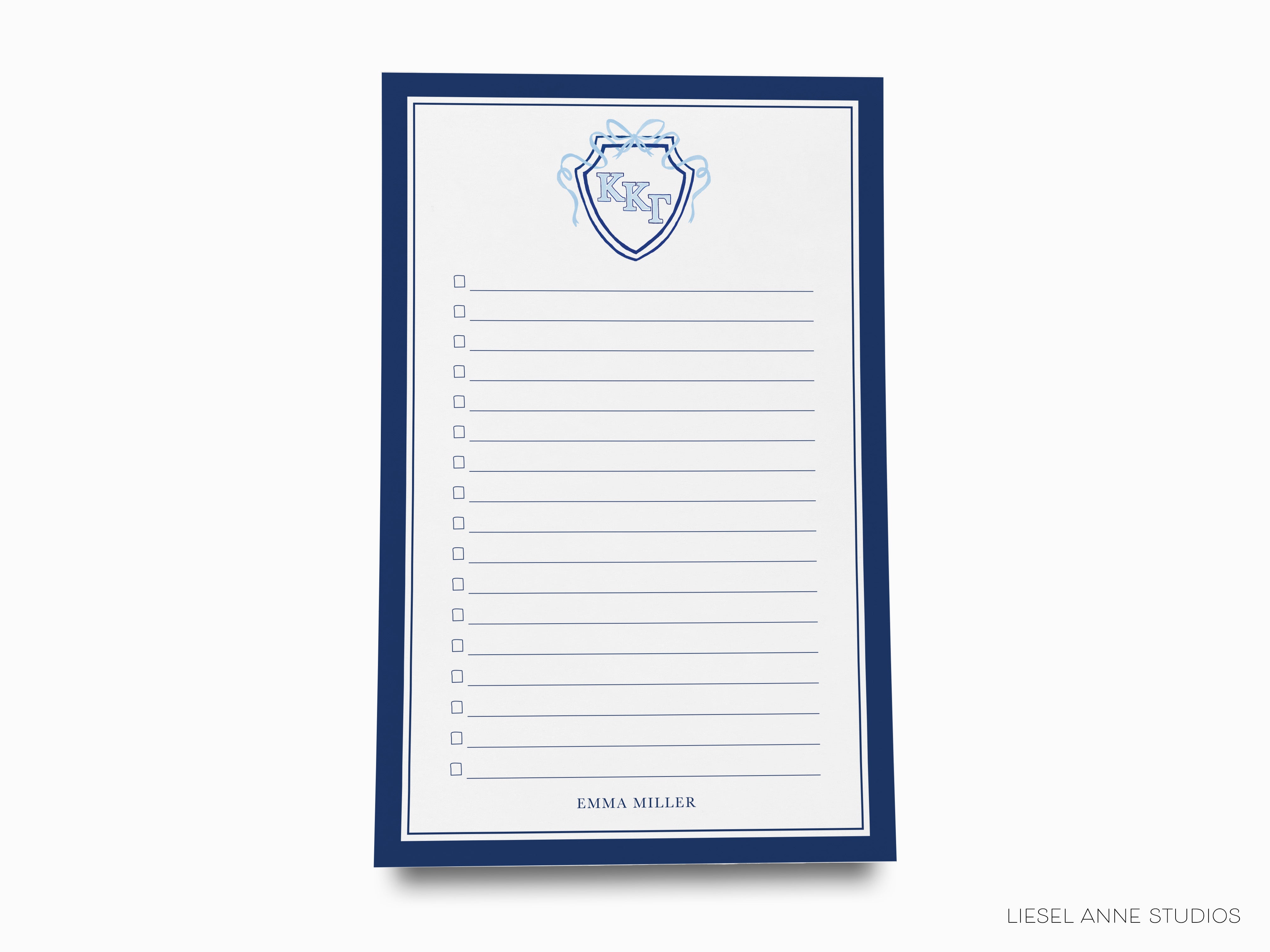 a notepad with a picture of a shield on it