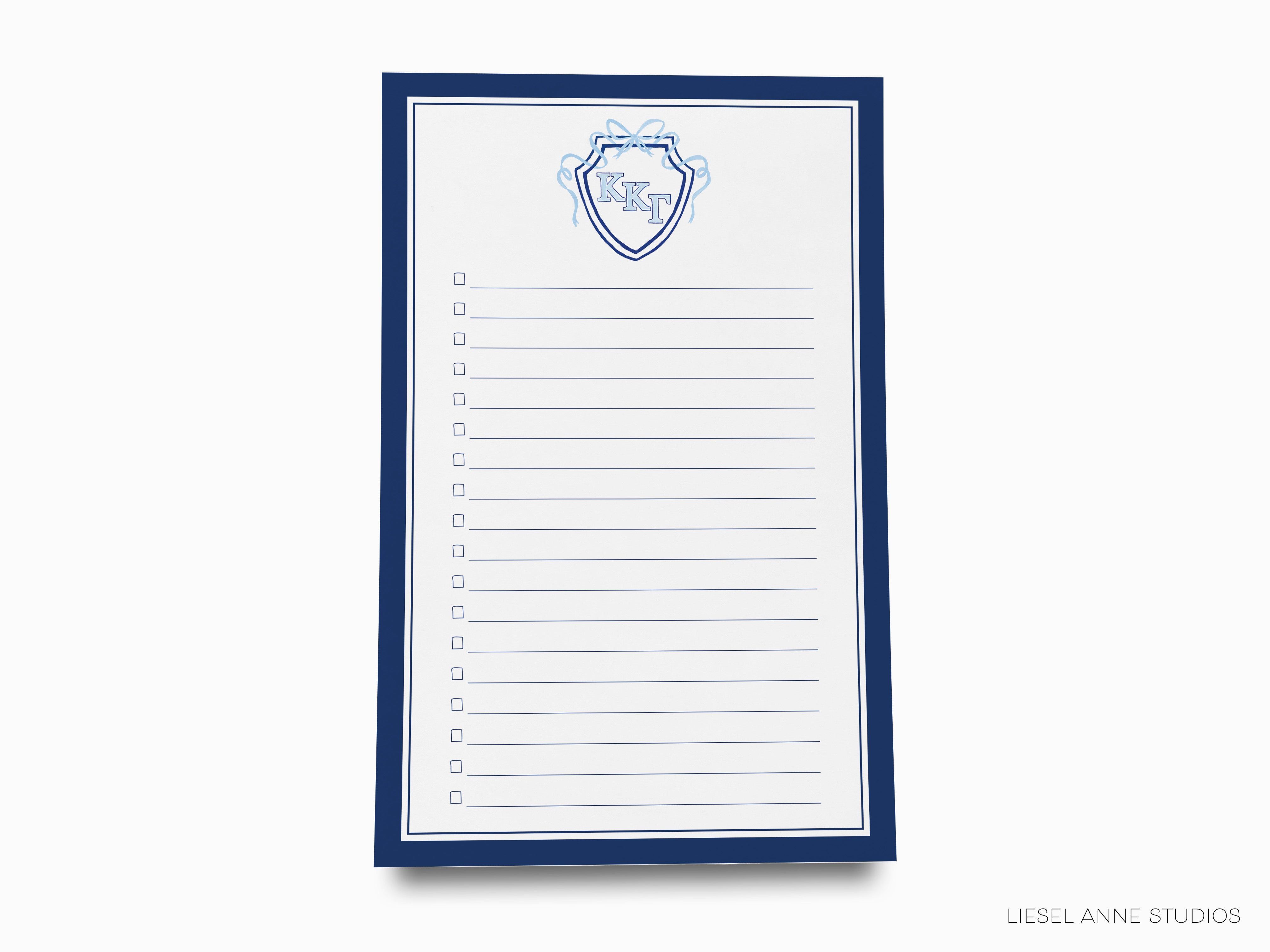 a notepad with a picture of a shield on it