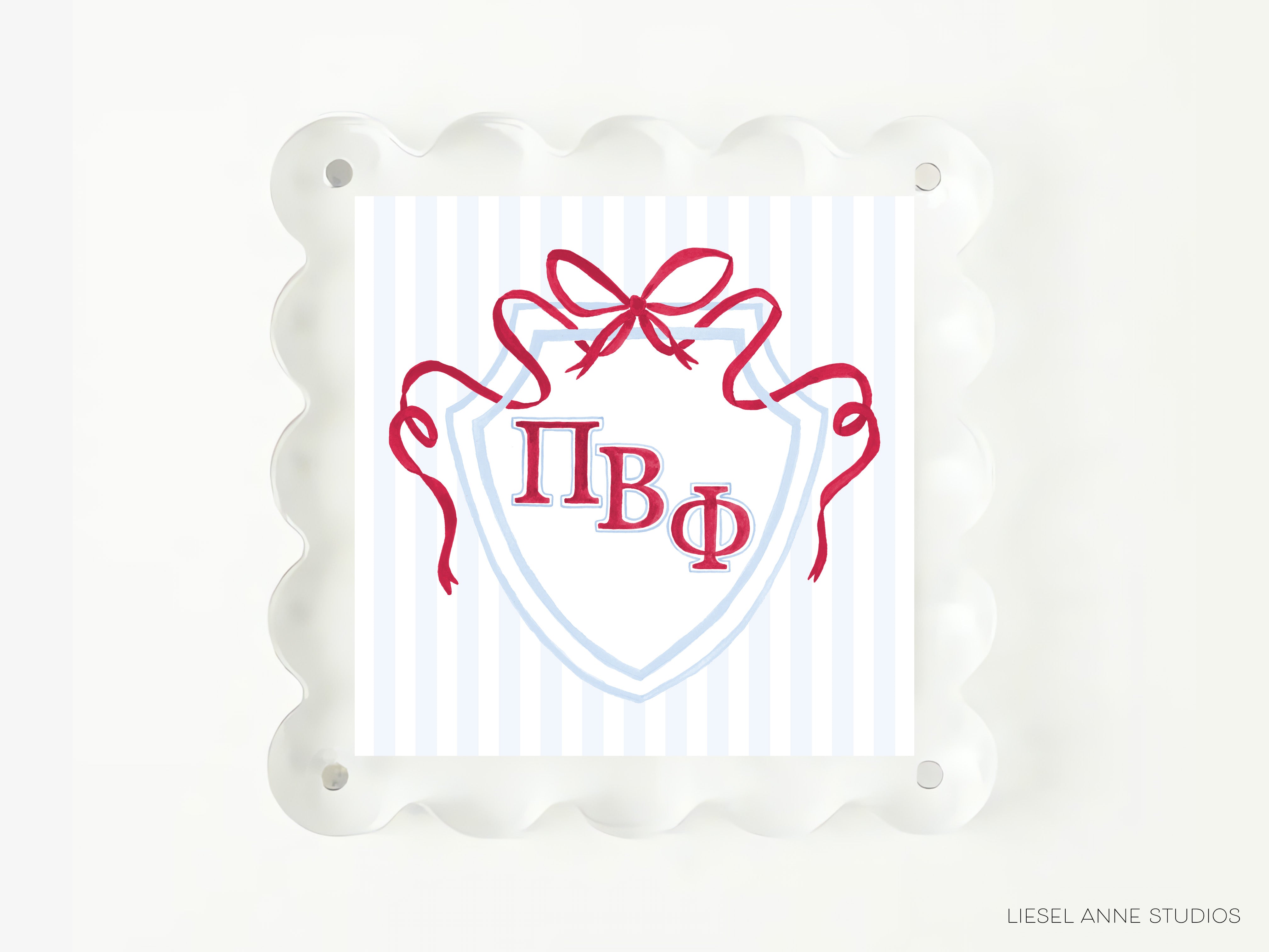 a shield-shaped design with a red ribbon and the Greek letters 'Φ', 'ΦΦ', and 'ΦΦΦ' prominently displayed.