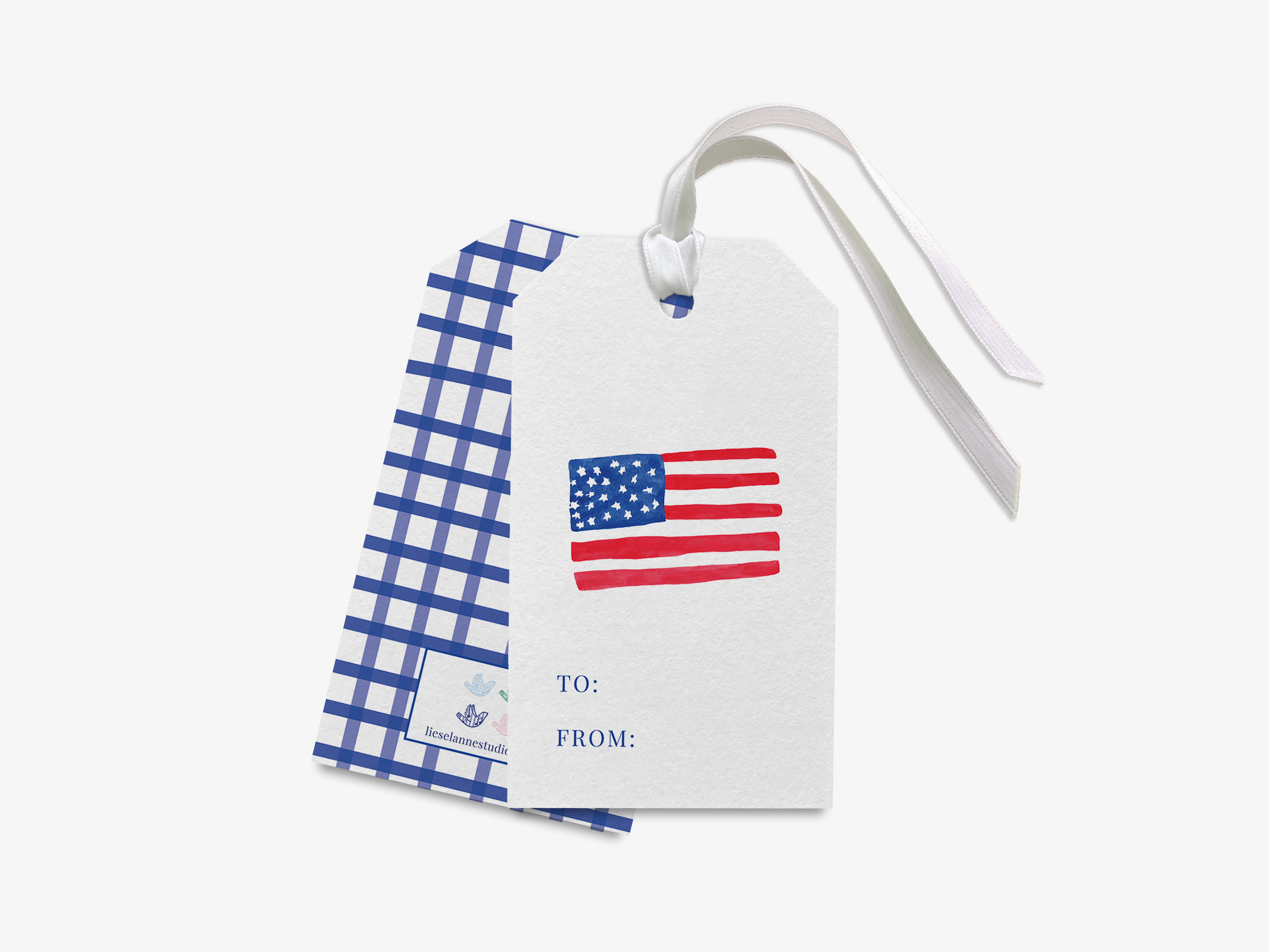 a white gift tag with a blue and white checkered pattern and an American flag design.