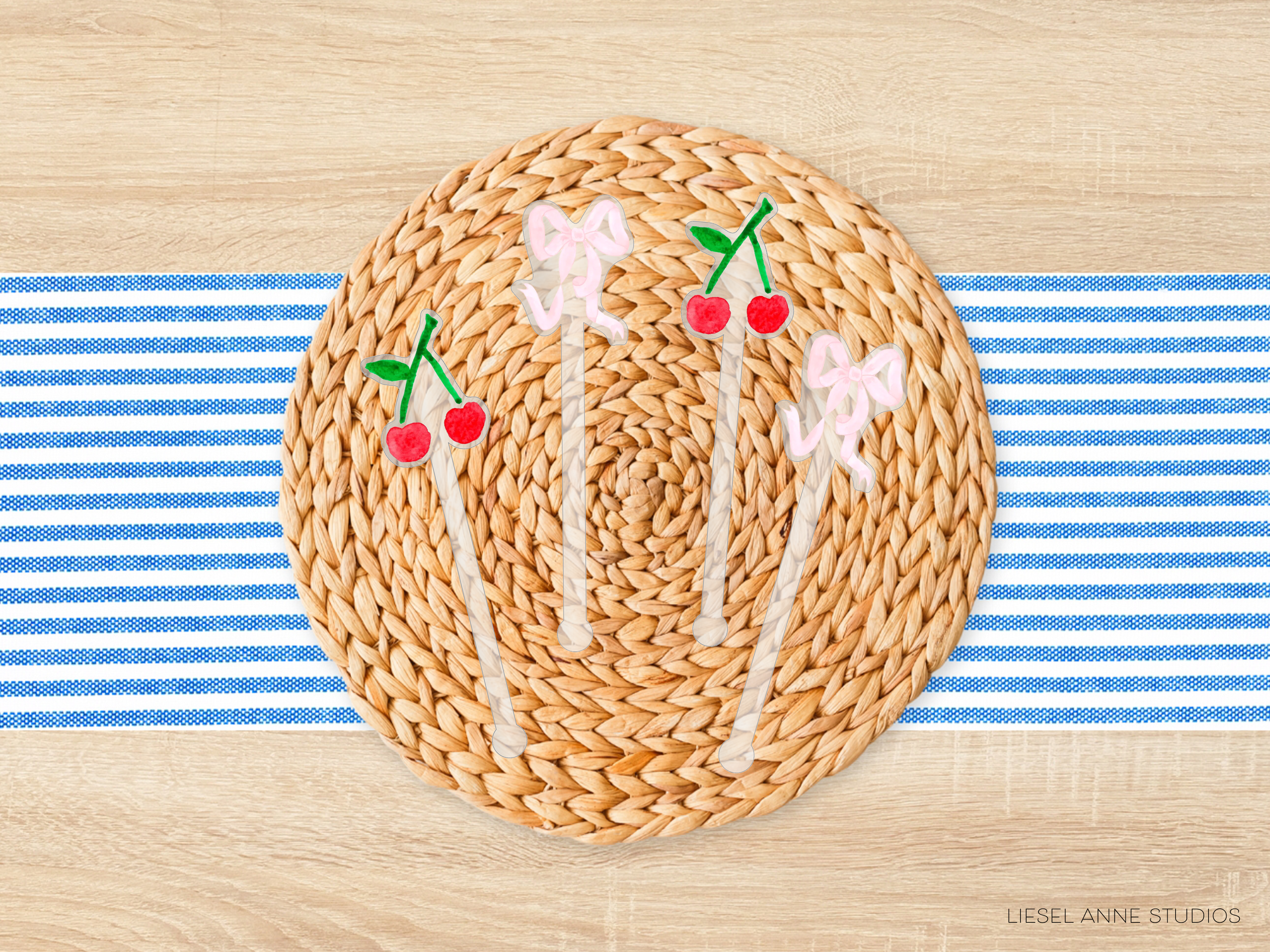 A woven placemat with a blue and white striped tablecloth, featuring decorative cherries and bows on a round wicker surface.