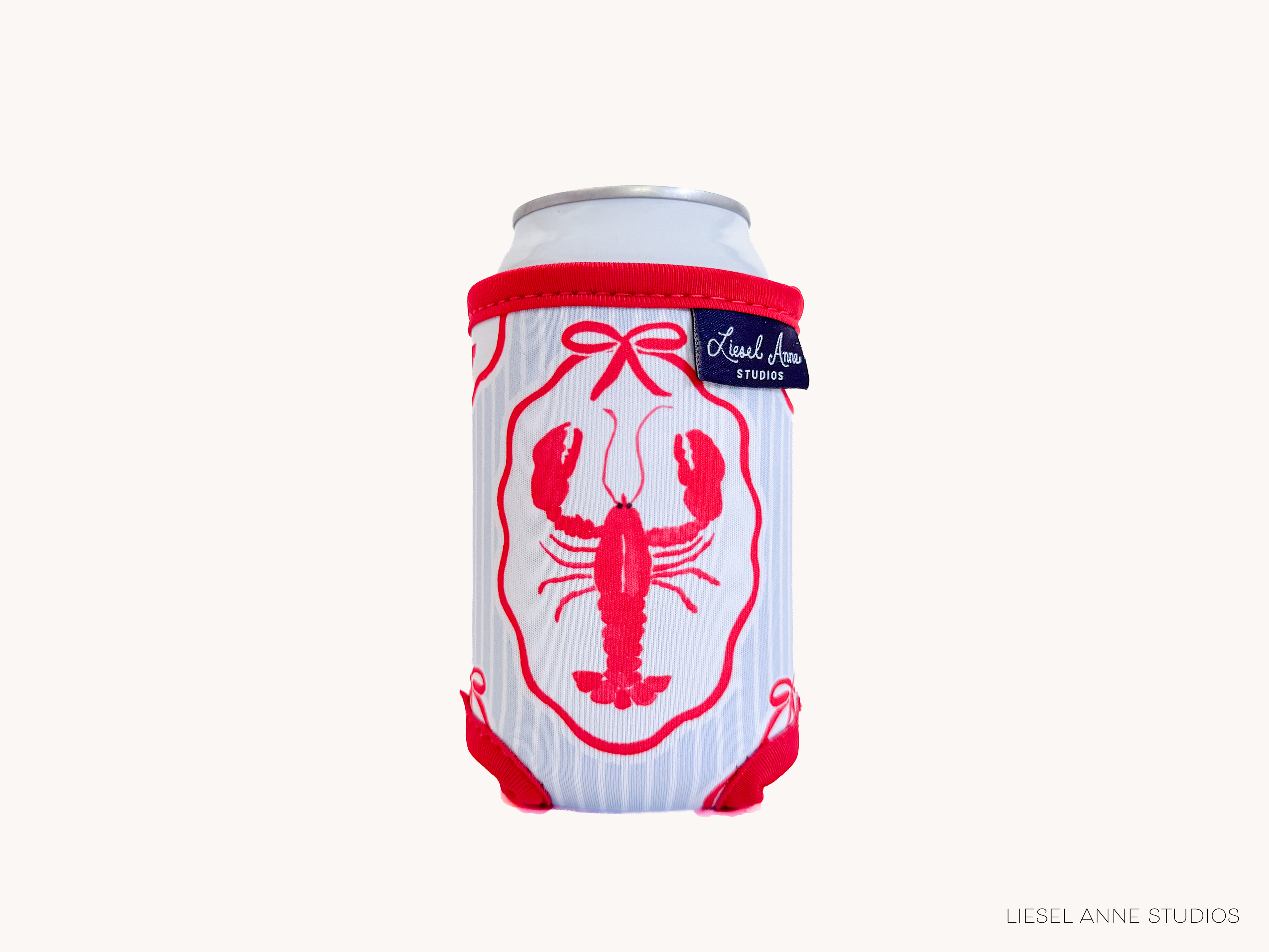 A can with a red lobster design on it, placed against a white background.