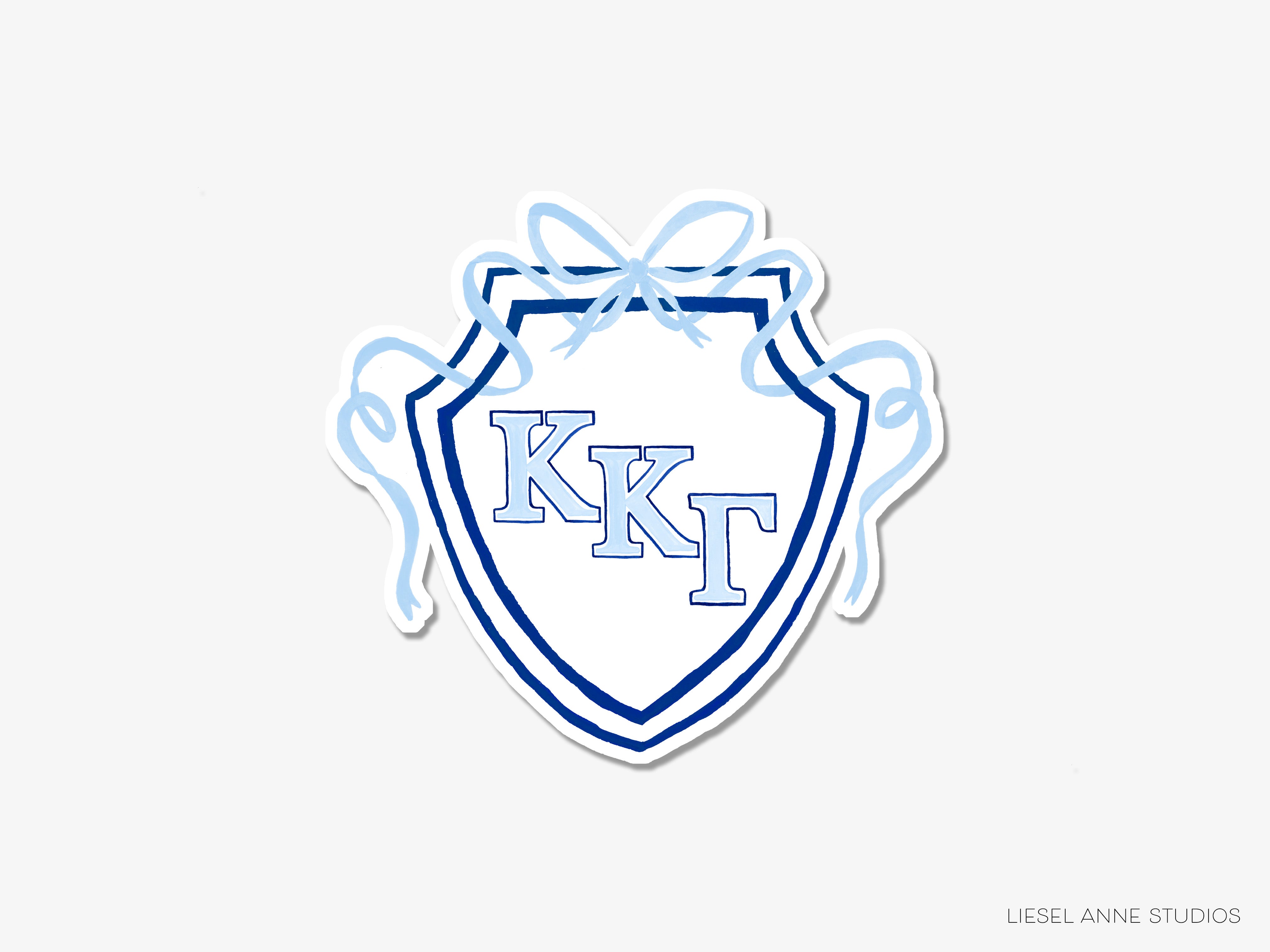 a blue and white sticker with the letter kt on it