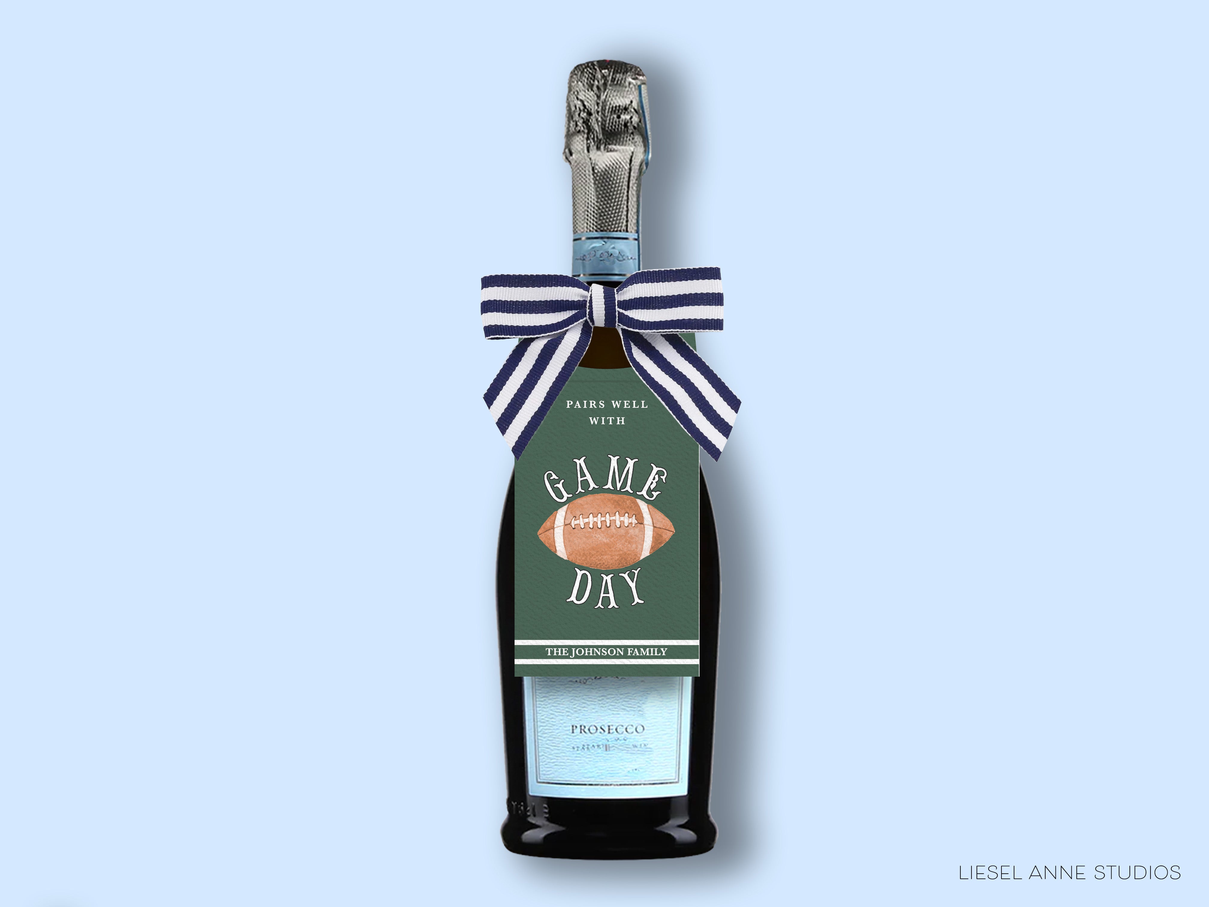 A bottle of Prosecco with a label that says "GAME DAY THE JOHNSON FAMILY" and a football graphic.