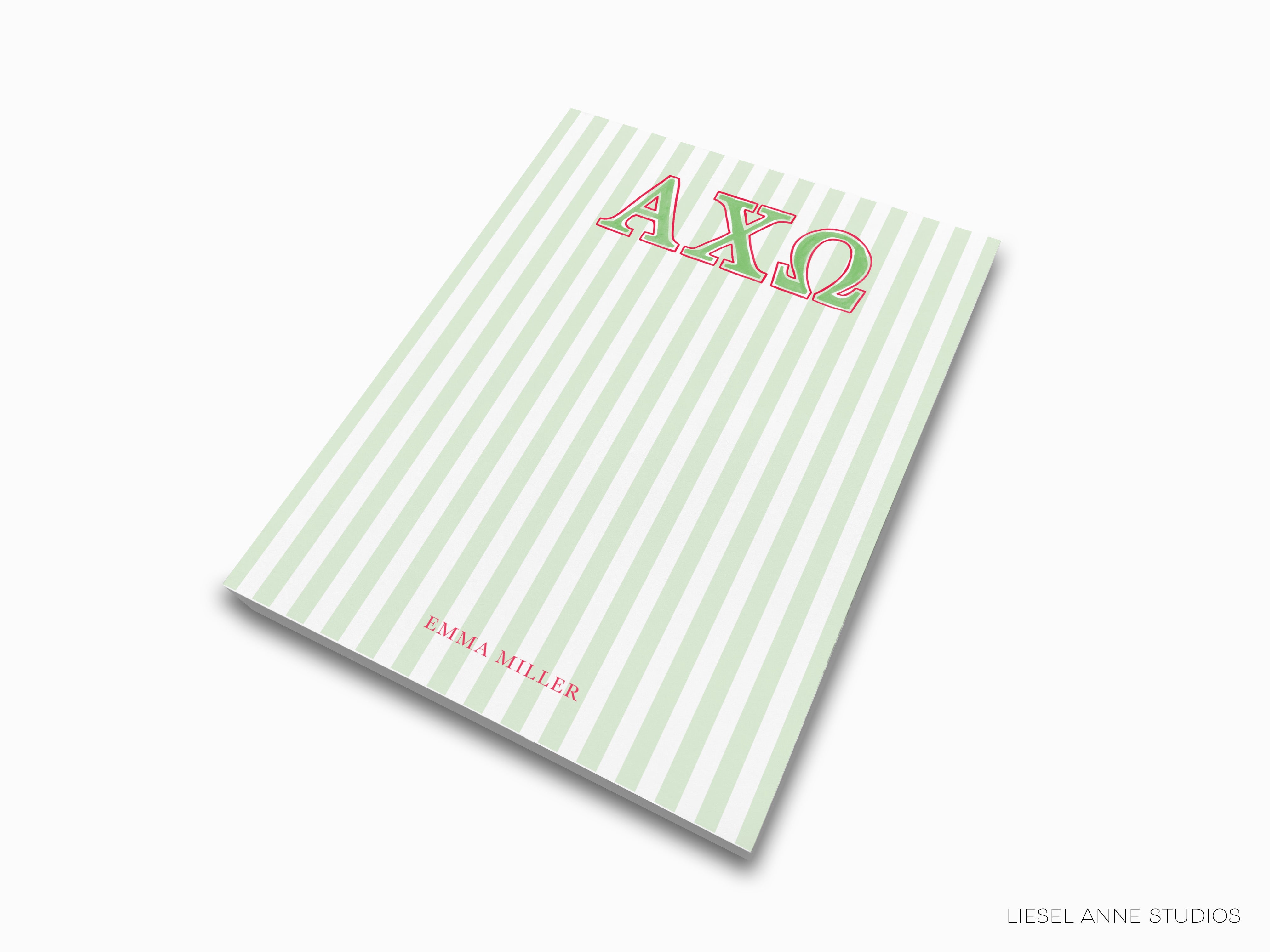 a green and white striped notebook with the word axo on it