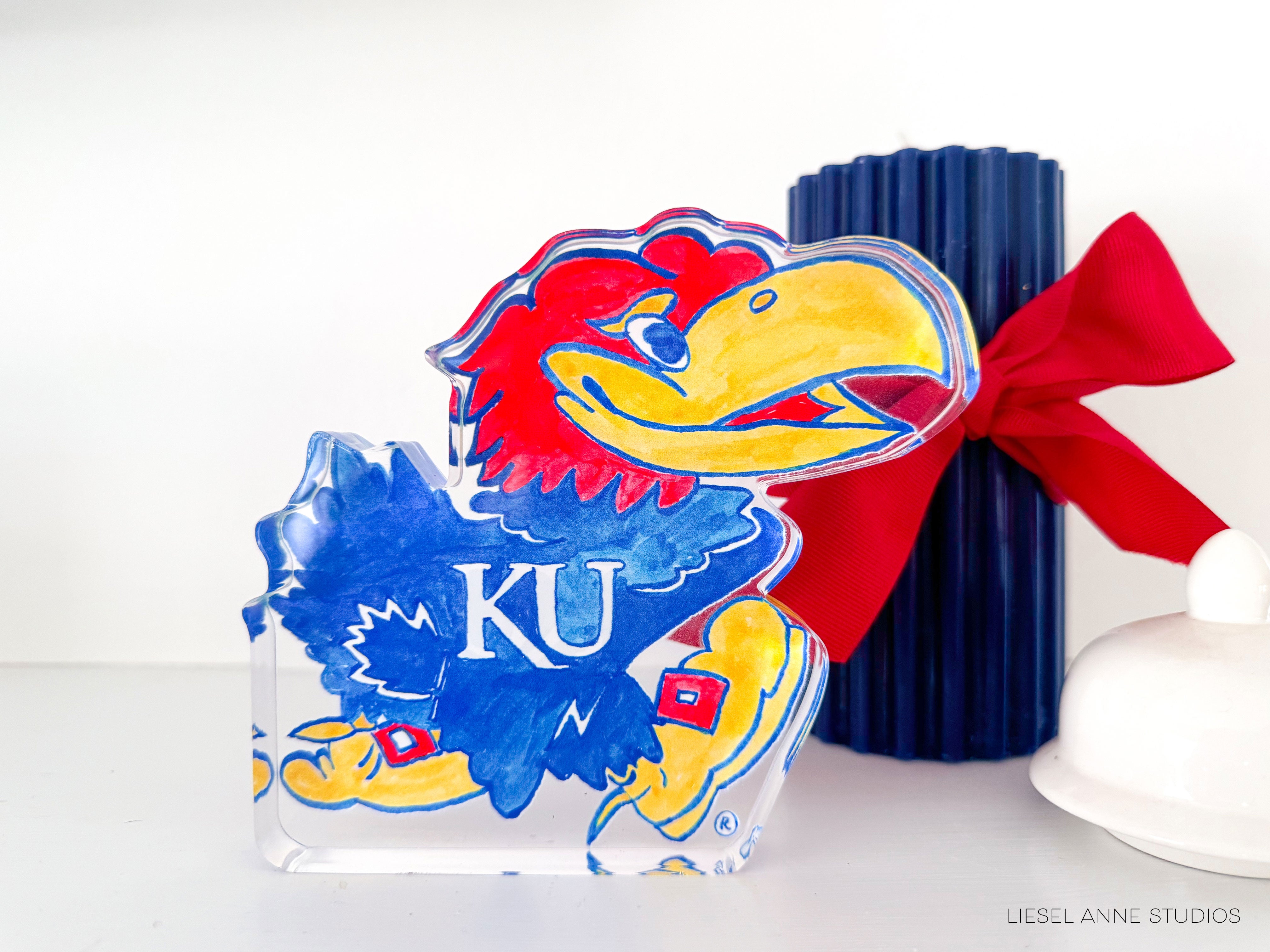 a glass block with a university of kansas mascot on it