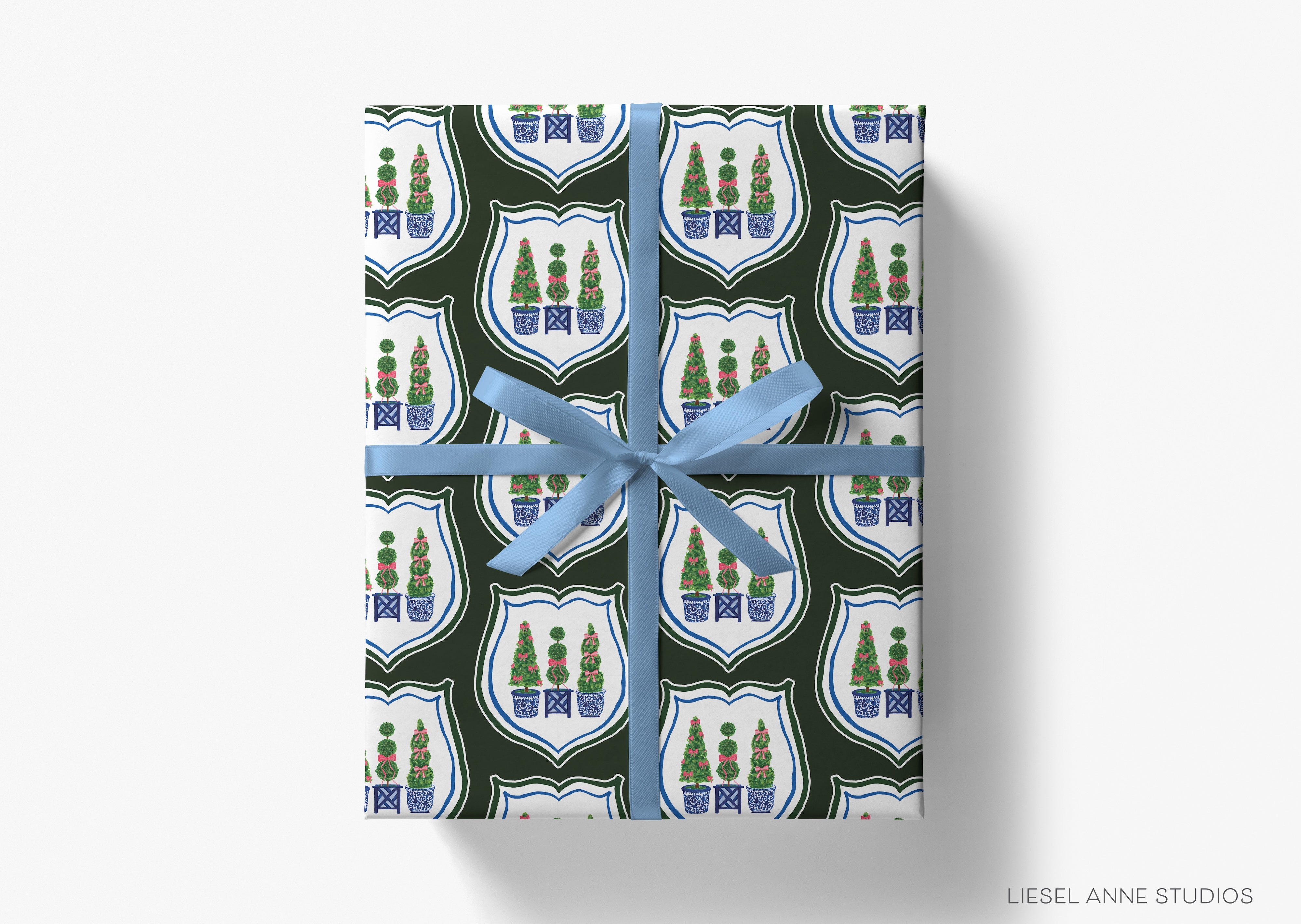 A gift box wrapped in a patterned wrapping paper with a blue ribbon.