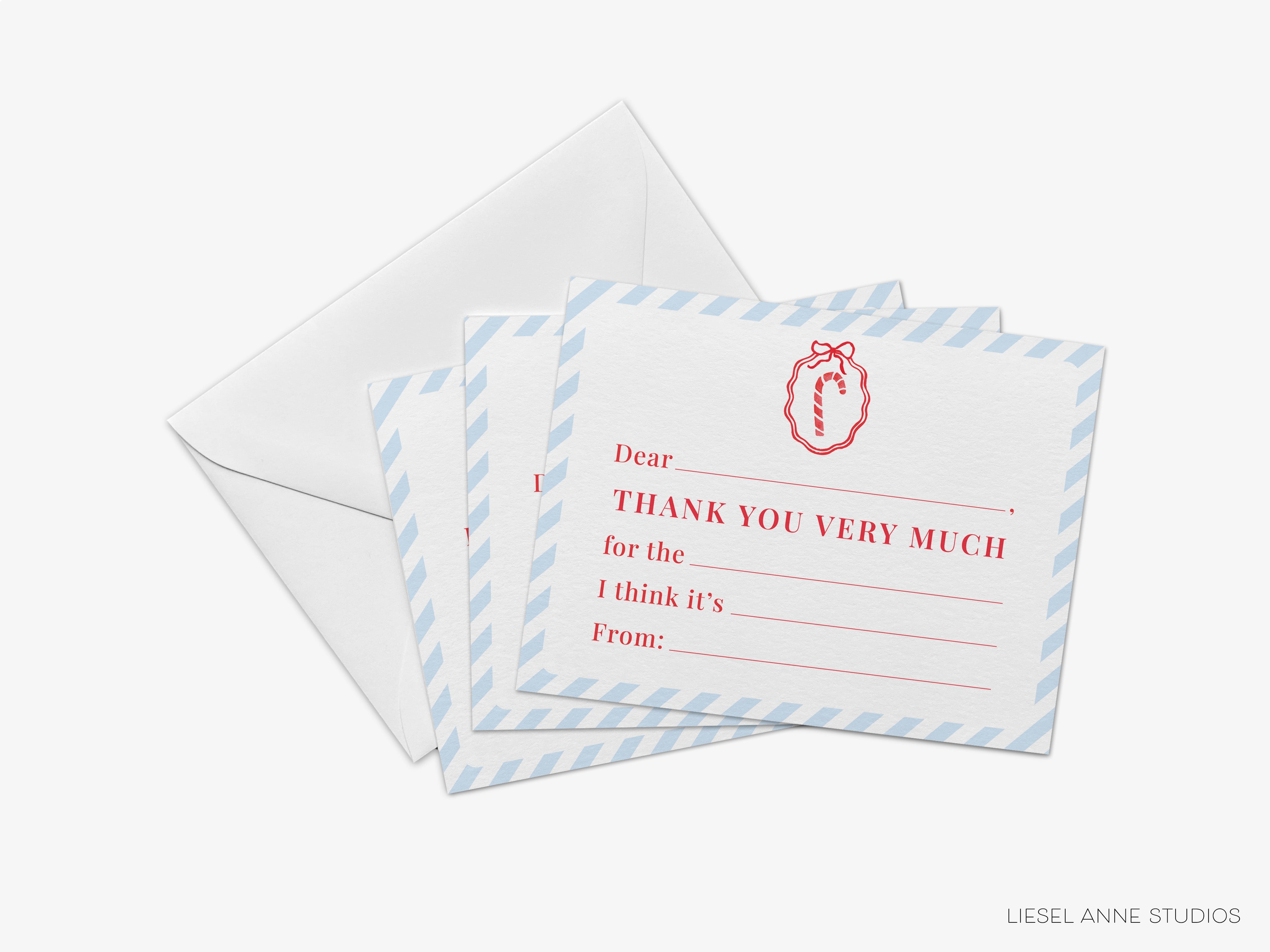 a set of blue and white striped envelopes with a red and white design on them, along with a note card inside one of the envelopes.