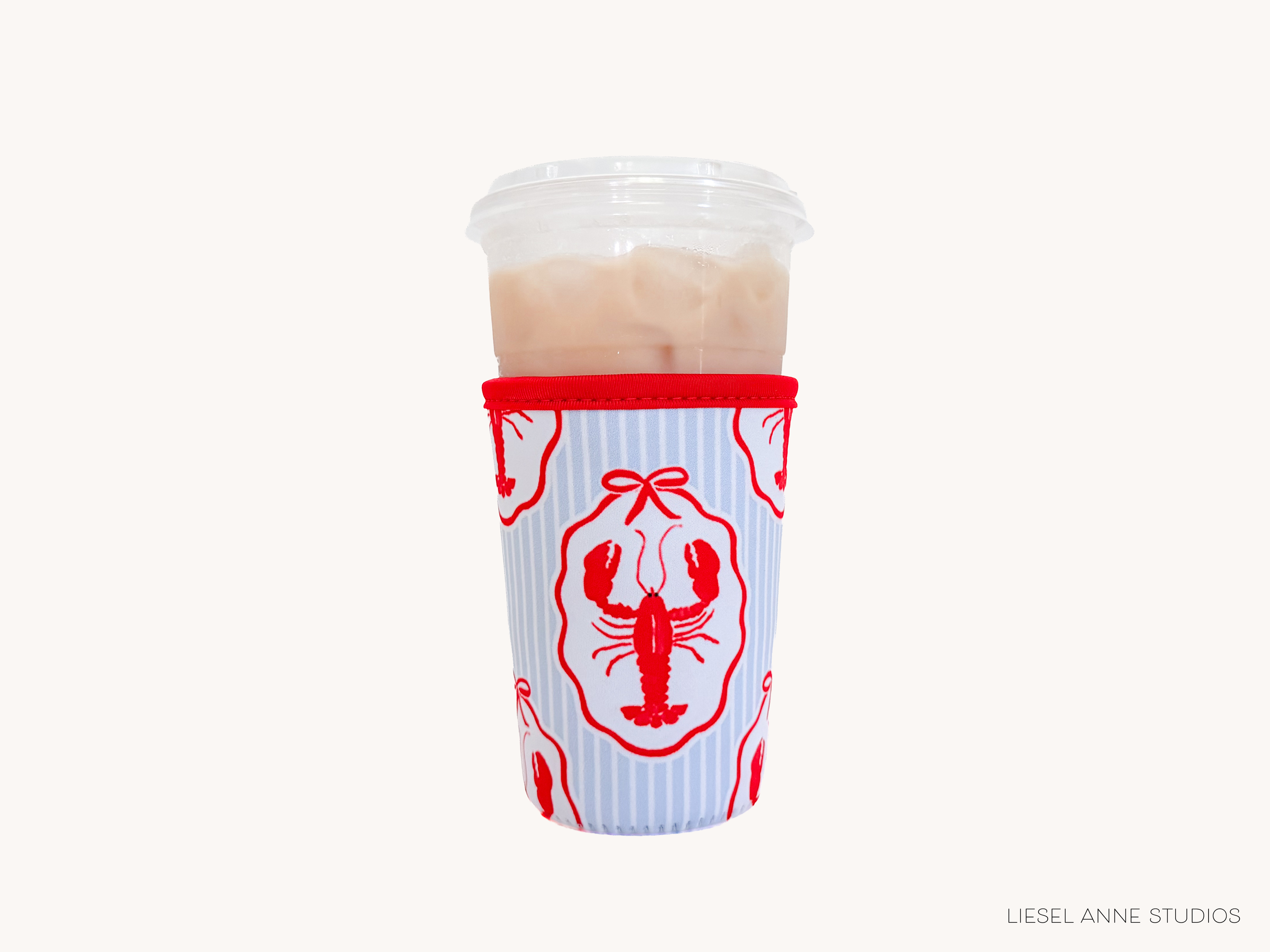 A cup with a red and white striped design featuring a lobster motif, placed against a white background.