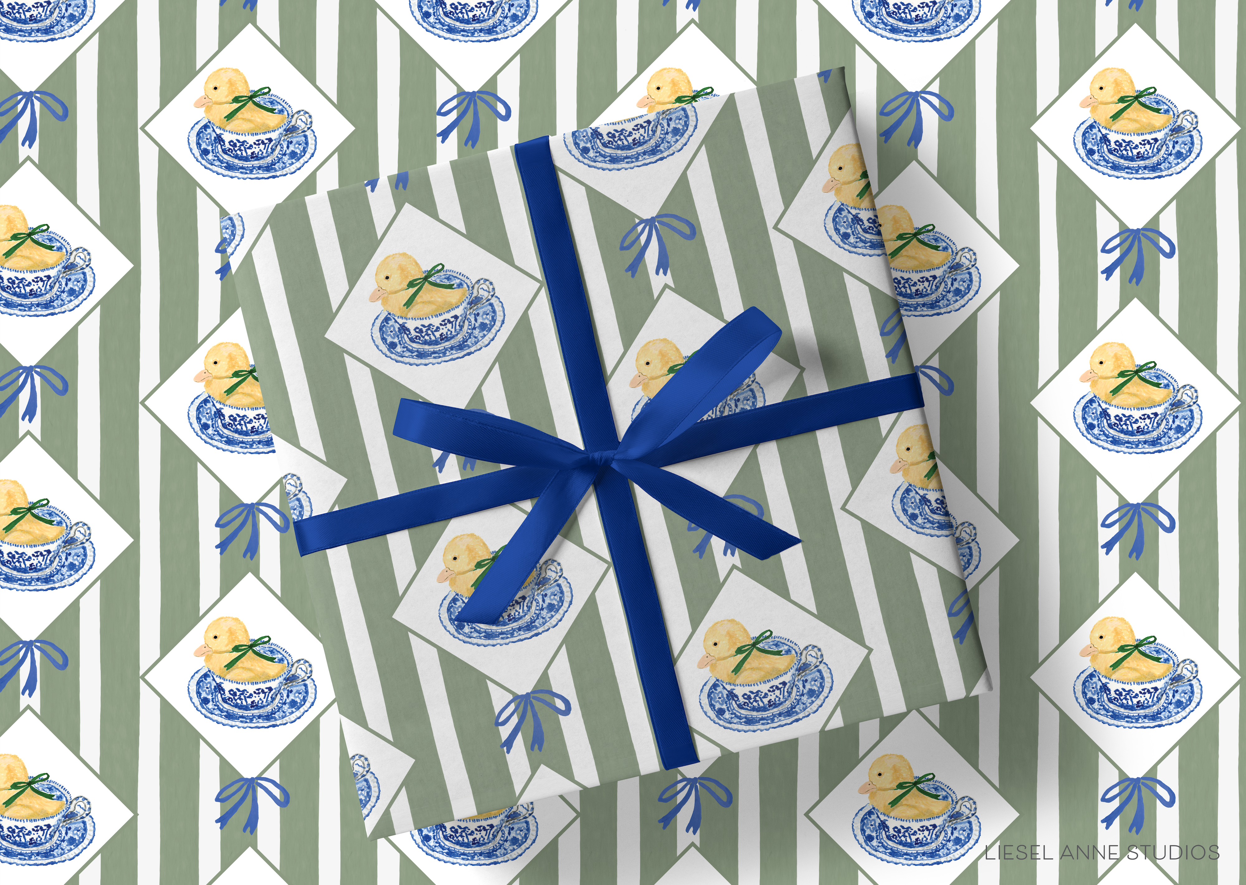 a gift wrapped in a striped paper with a blue ribbon. The paper has a repeating pattern of yellow ducks in blue and white bowls, creating a playful and festive design.