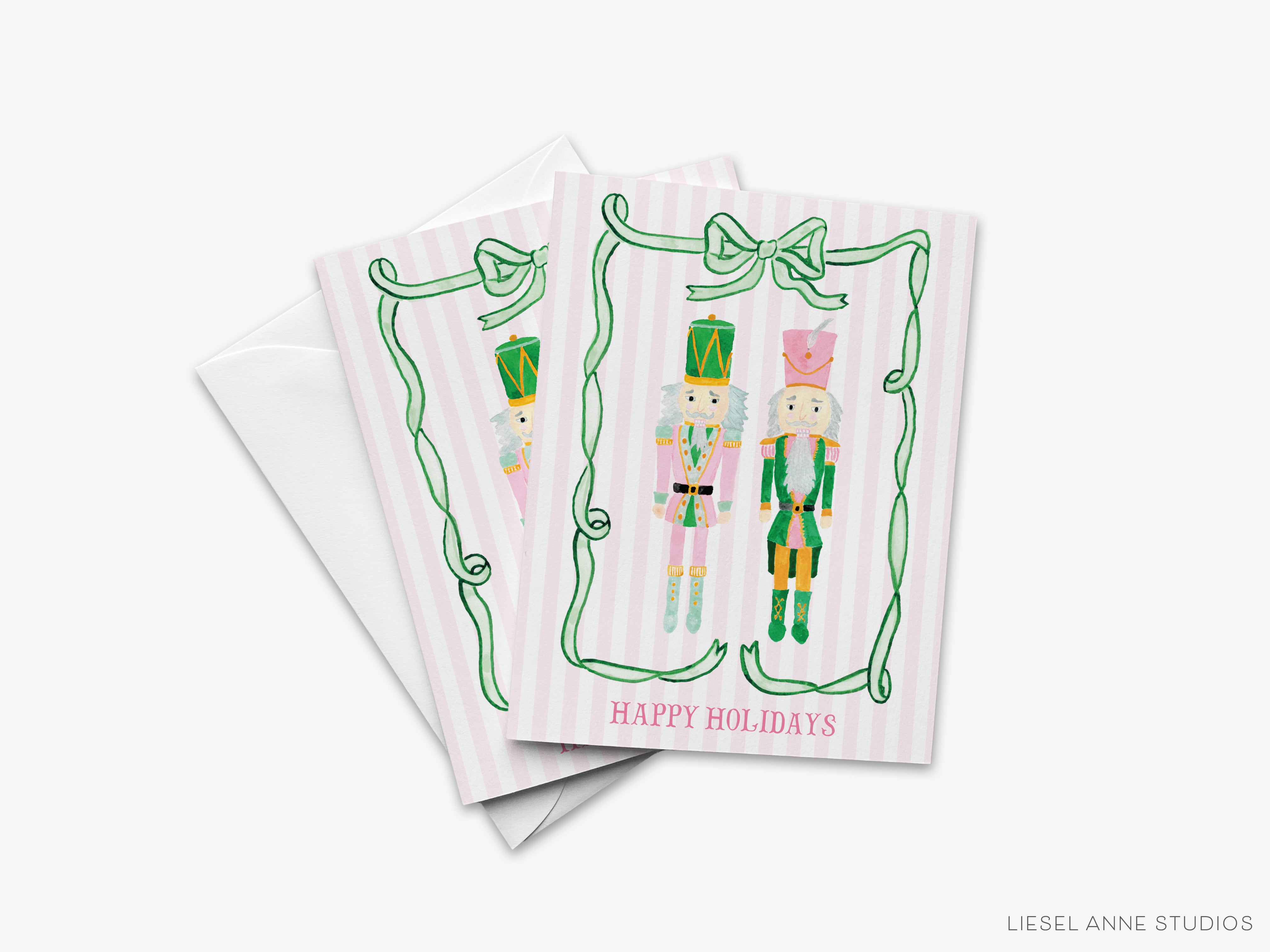 A set of three holiday greeting cards featuring nutcracker characters in festive outfits.