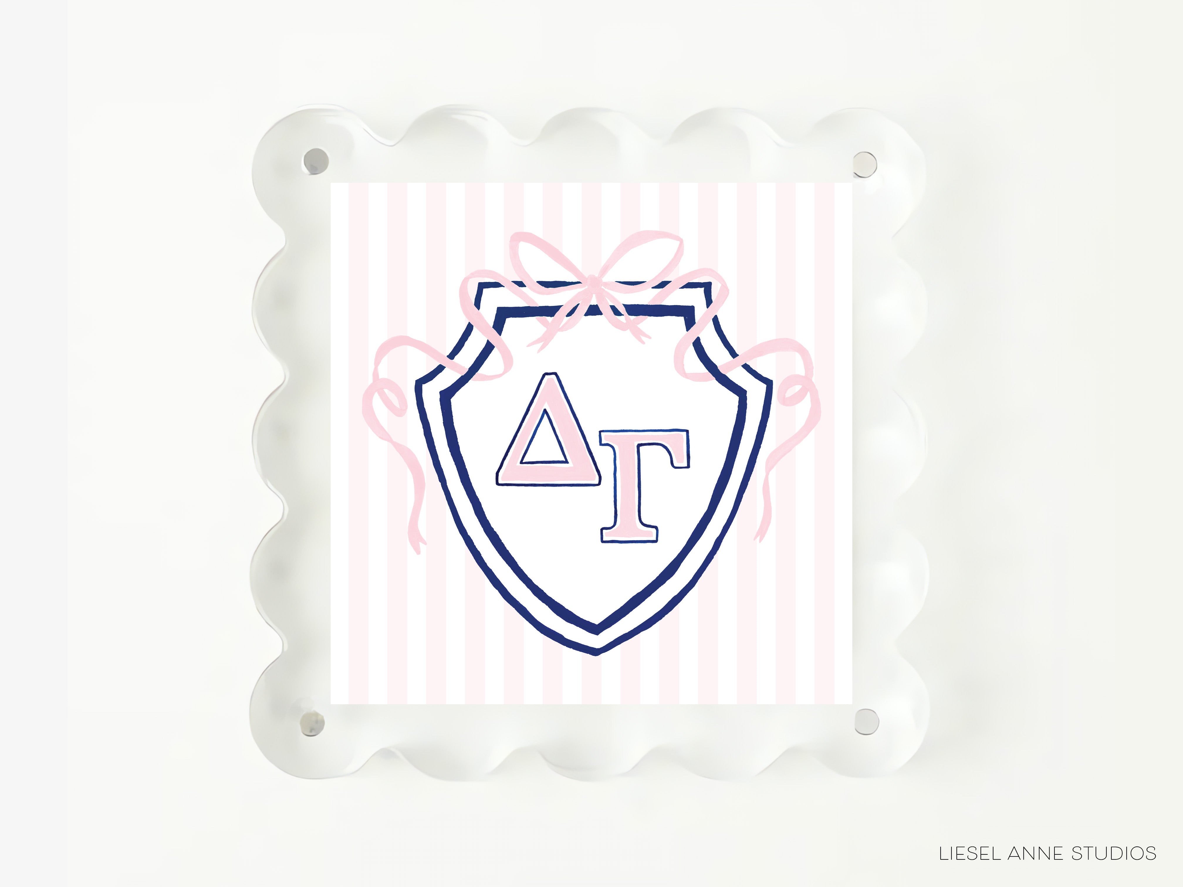 A shield-shaped graphic with a pink ribbon and the letters 'ΔΕΛΙ' (Delta Sigma Theta) on it, all set against a white background.