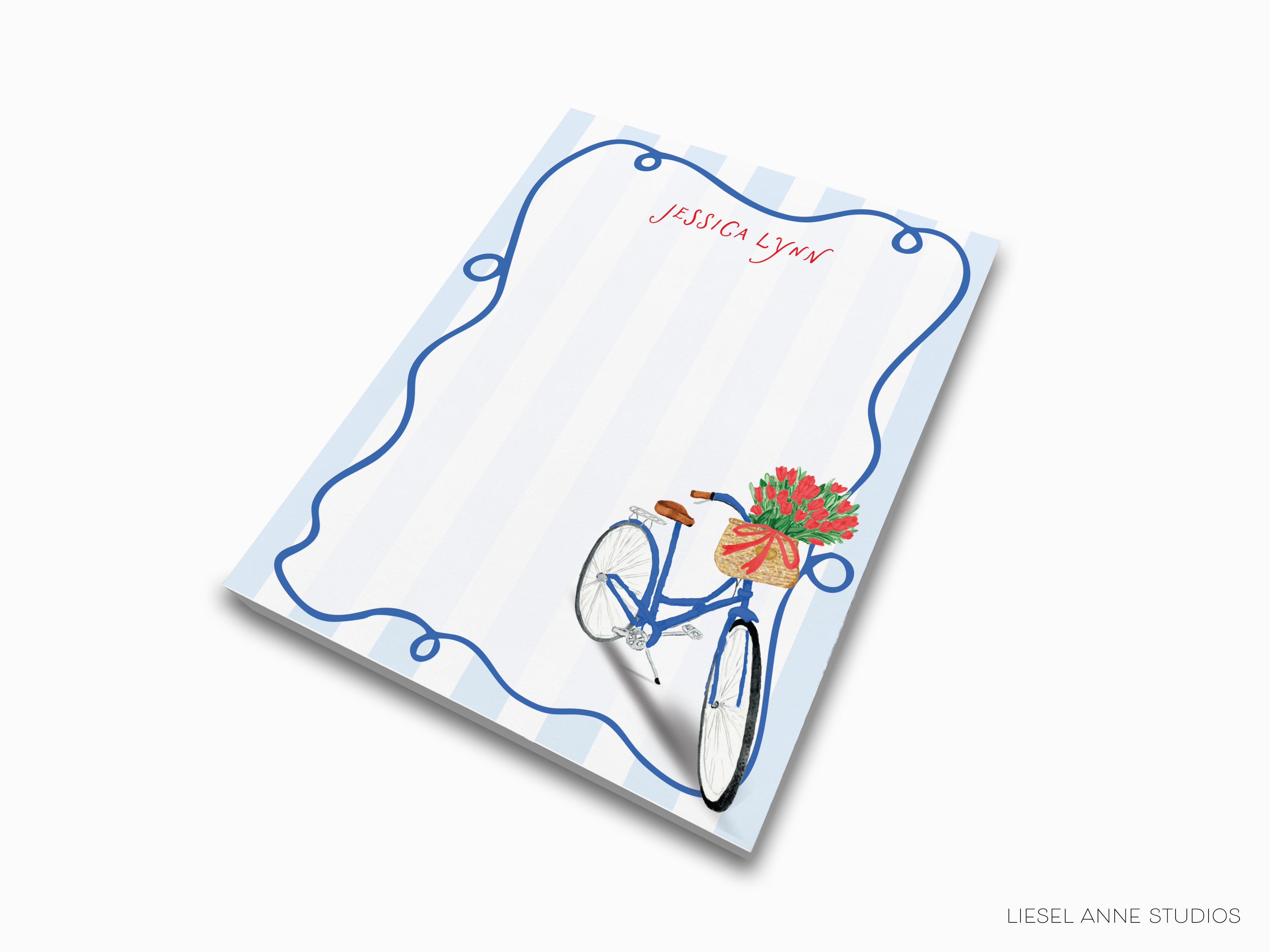 A blue bicycle with a basket of flowers on the handlebars is depicted on a white background with a blue border.