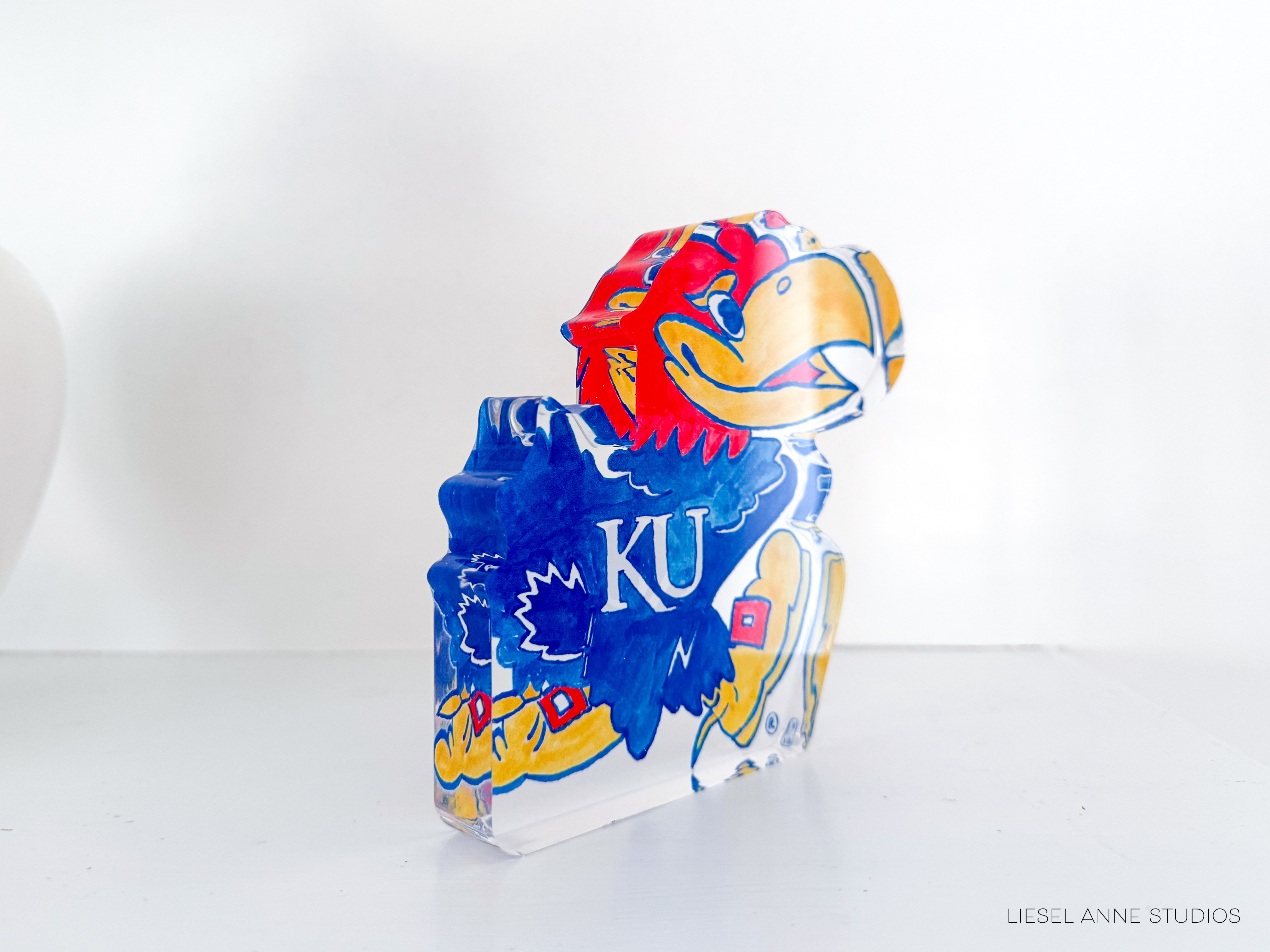 a university of kansas balloon sitting on top of a table