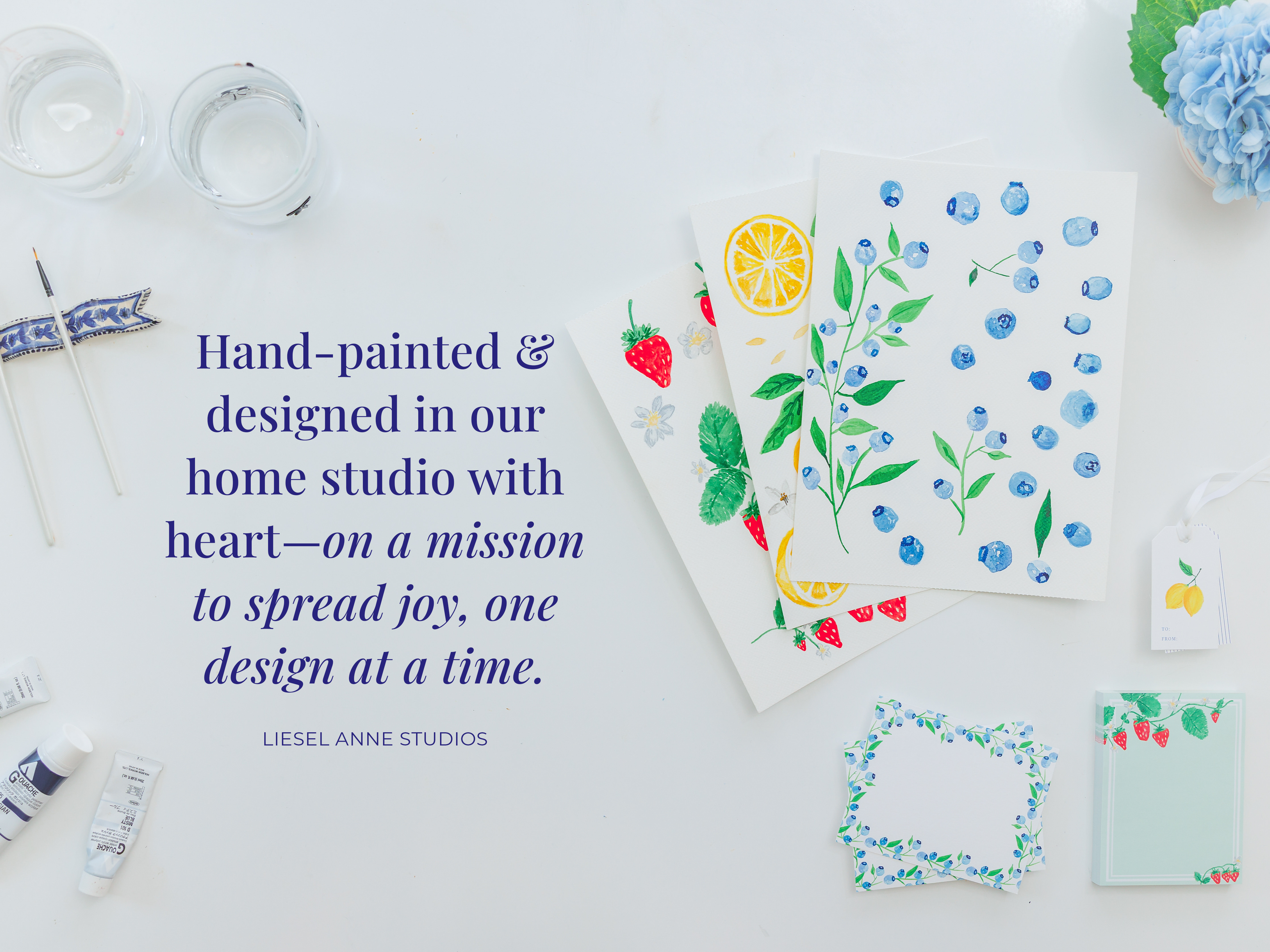 The image is a collage of various art supplies and hand-painted designs, including watercolor paintings, sketchbooks, and decorative items.