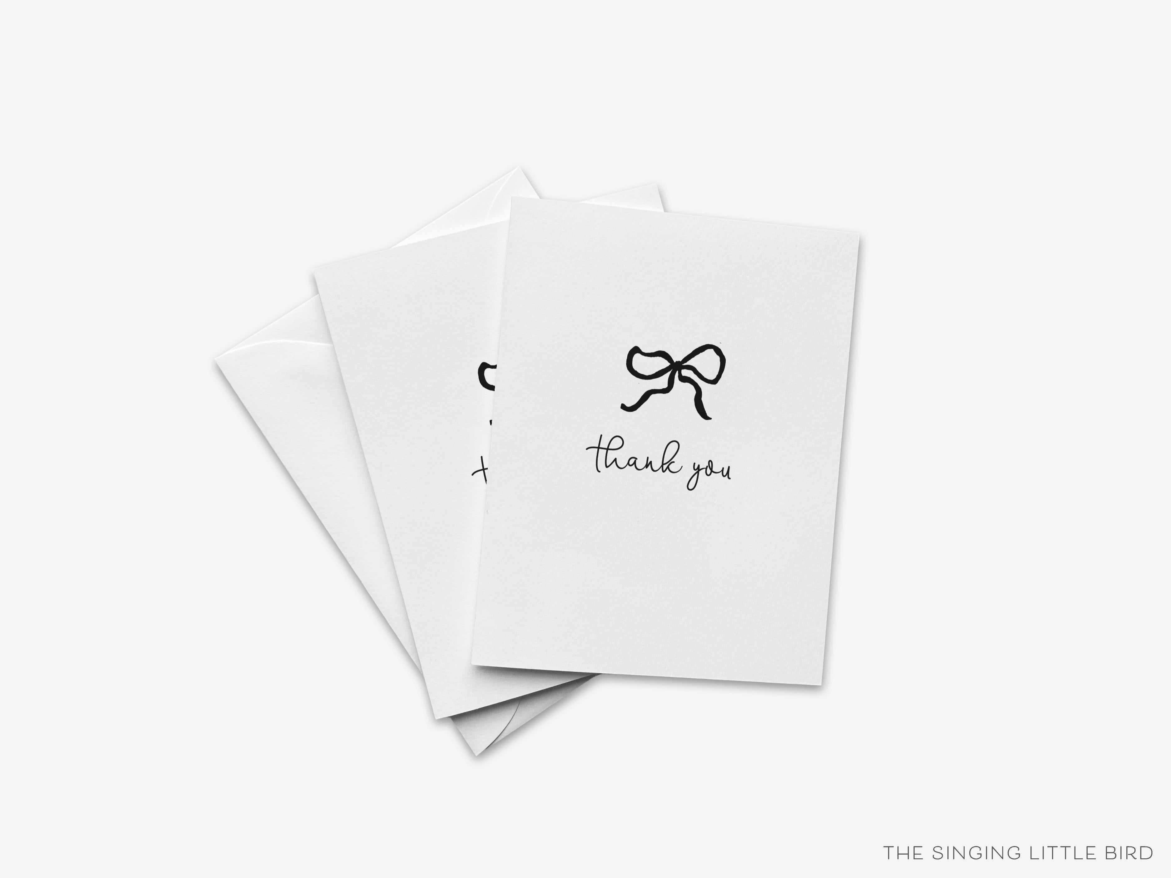 Black Bow Thank You Greeting Card-These folded greeting cards are 4.25x5.5 and feature our hand-painted black bow, printed in the USA on 100lb textured stock. They come with a White envelope and make a great thank you card for the black and white chic lover in your life.-The Singing Little Bird