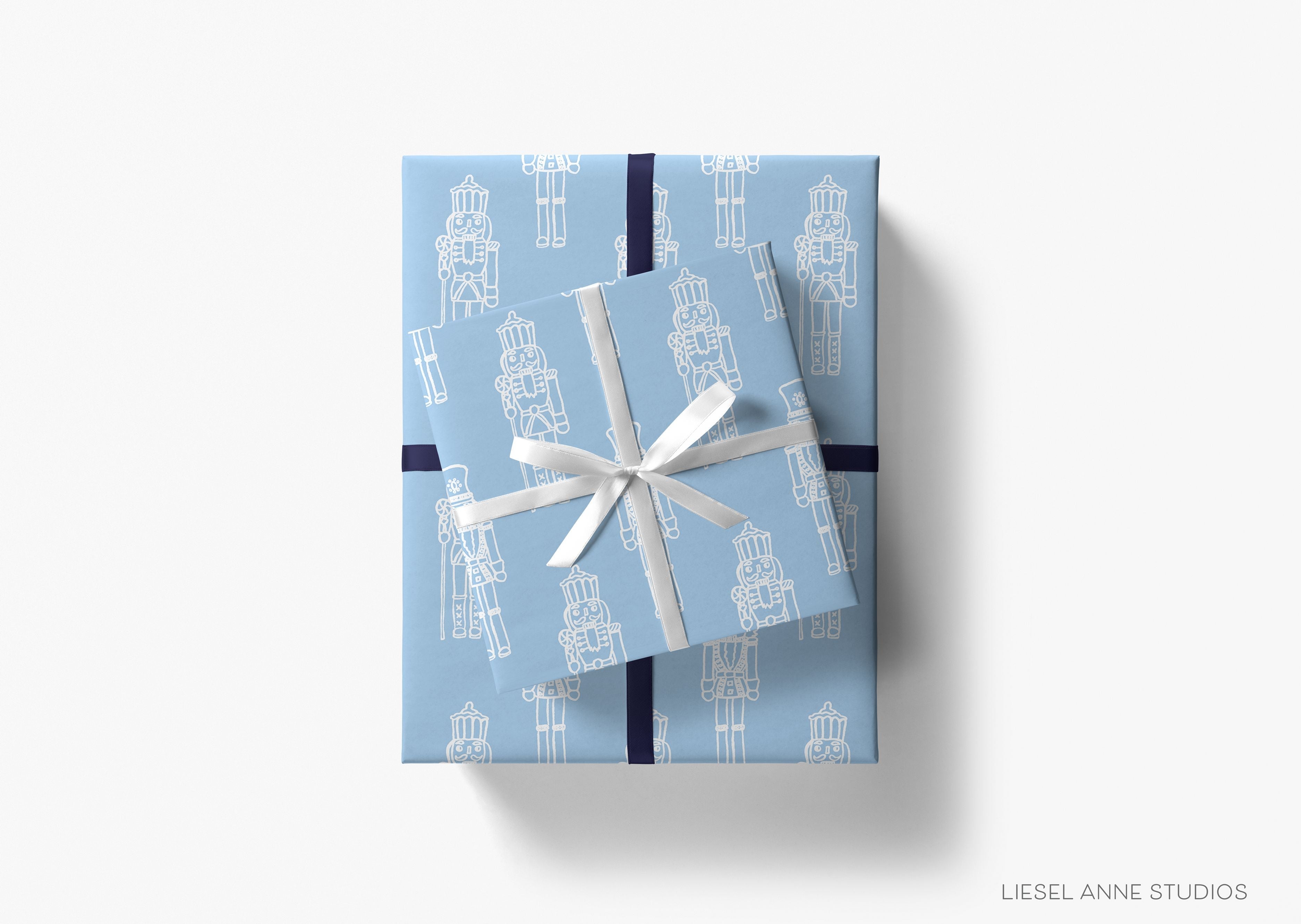 Blue Nutcracker Christmas Gift Wrap-This matte finish gift wrap features our hand-painted watercolor nutcrackers. It makes a perfect wrapping paper for a holiday present. -The Singing Little Bird